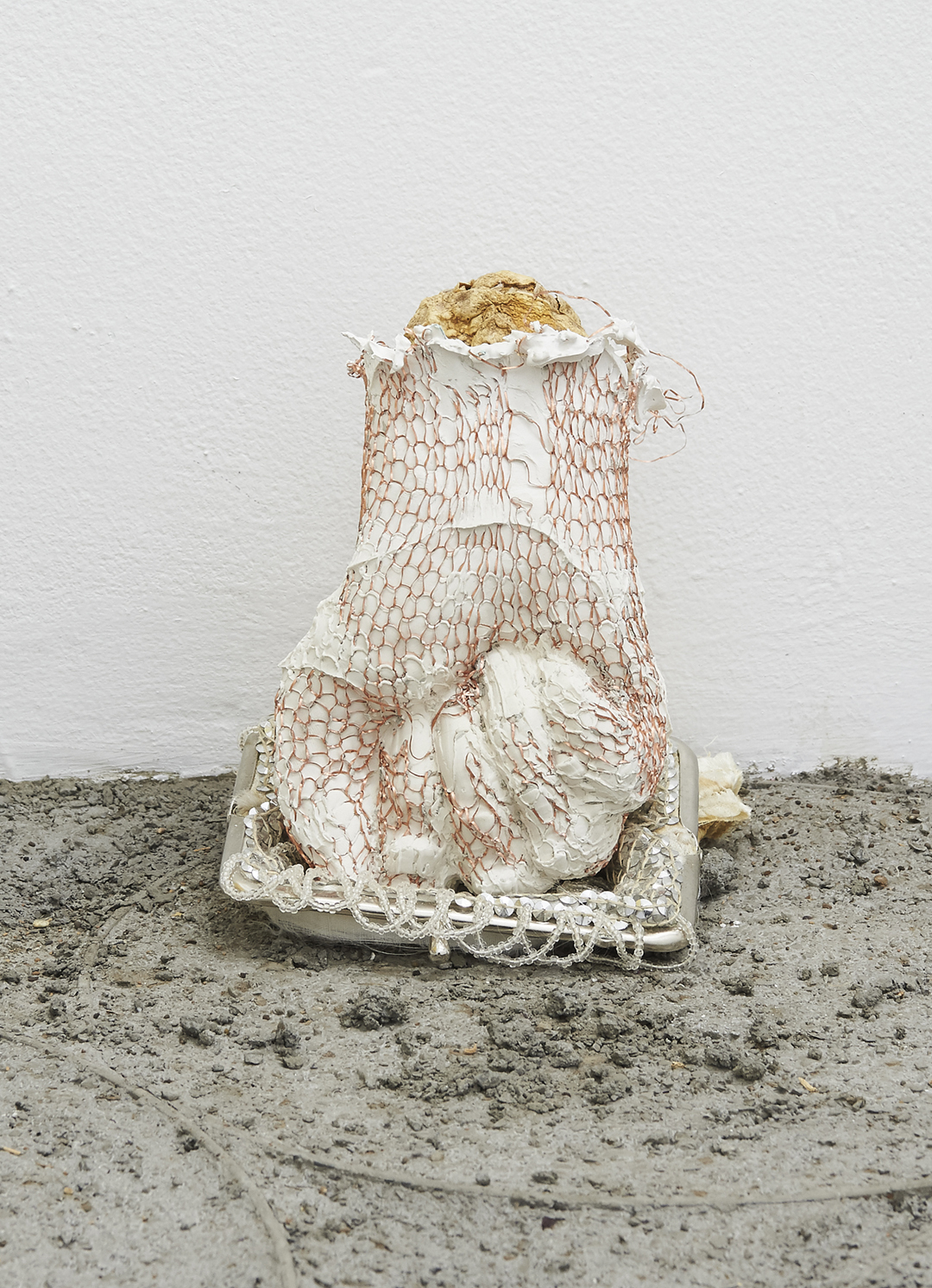 Jenine Marsh, am i worth anything or am i shit (fist on purse), 2020, hydrocal, copper wire, flower bulb, secondhand beaded purse