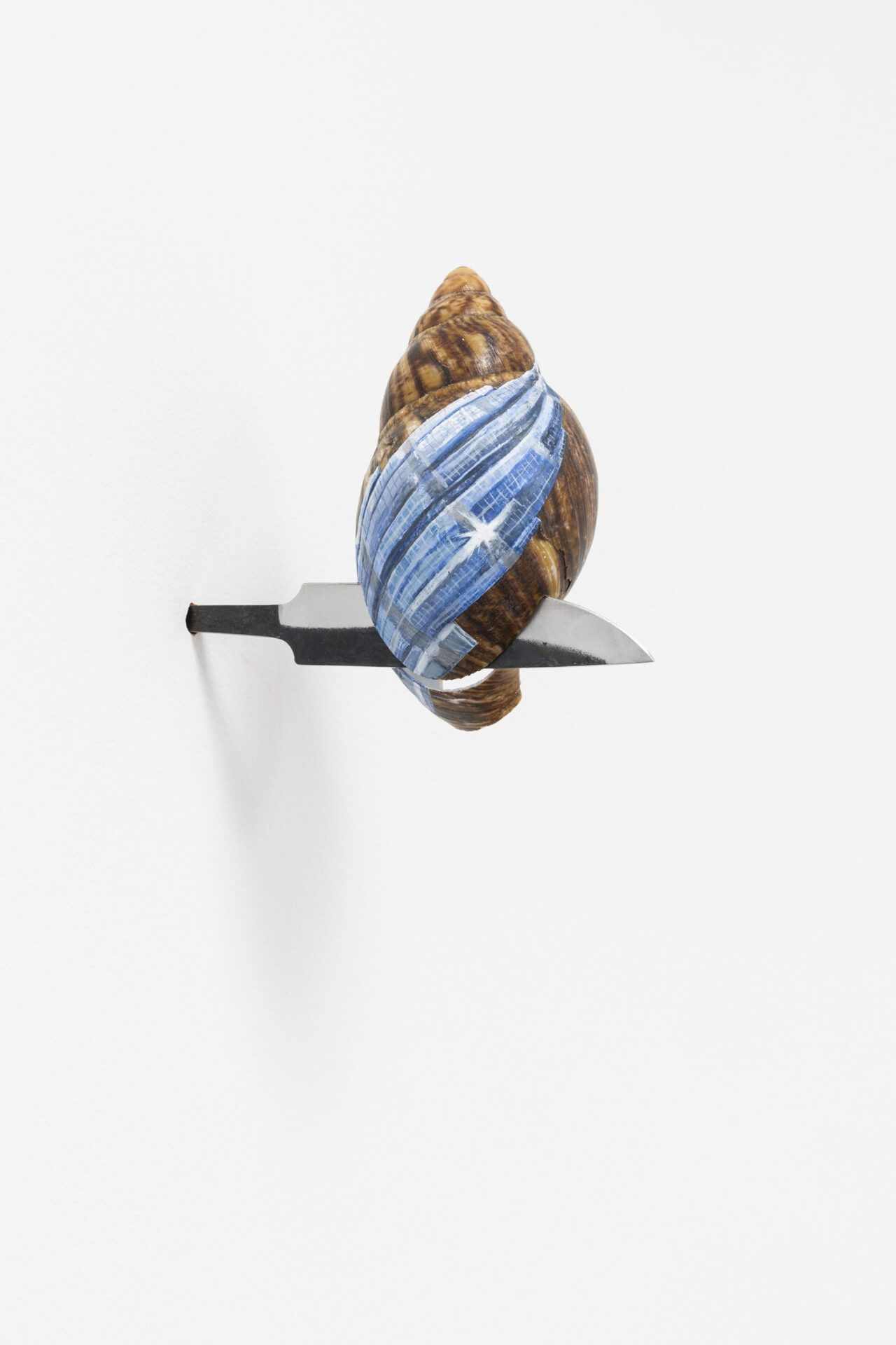 Bradley Davies & Jasmin Werner, "untitled", african snail shell on forged knife (metal), paint, varnish, ganache, dimensions variable, 2020