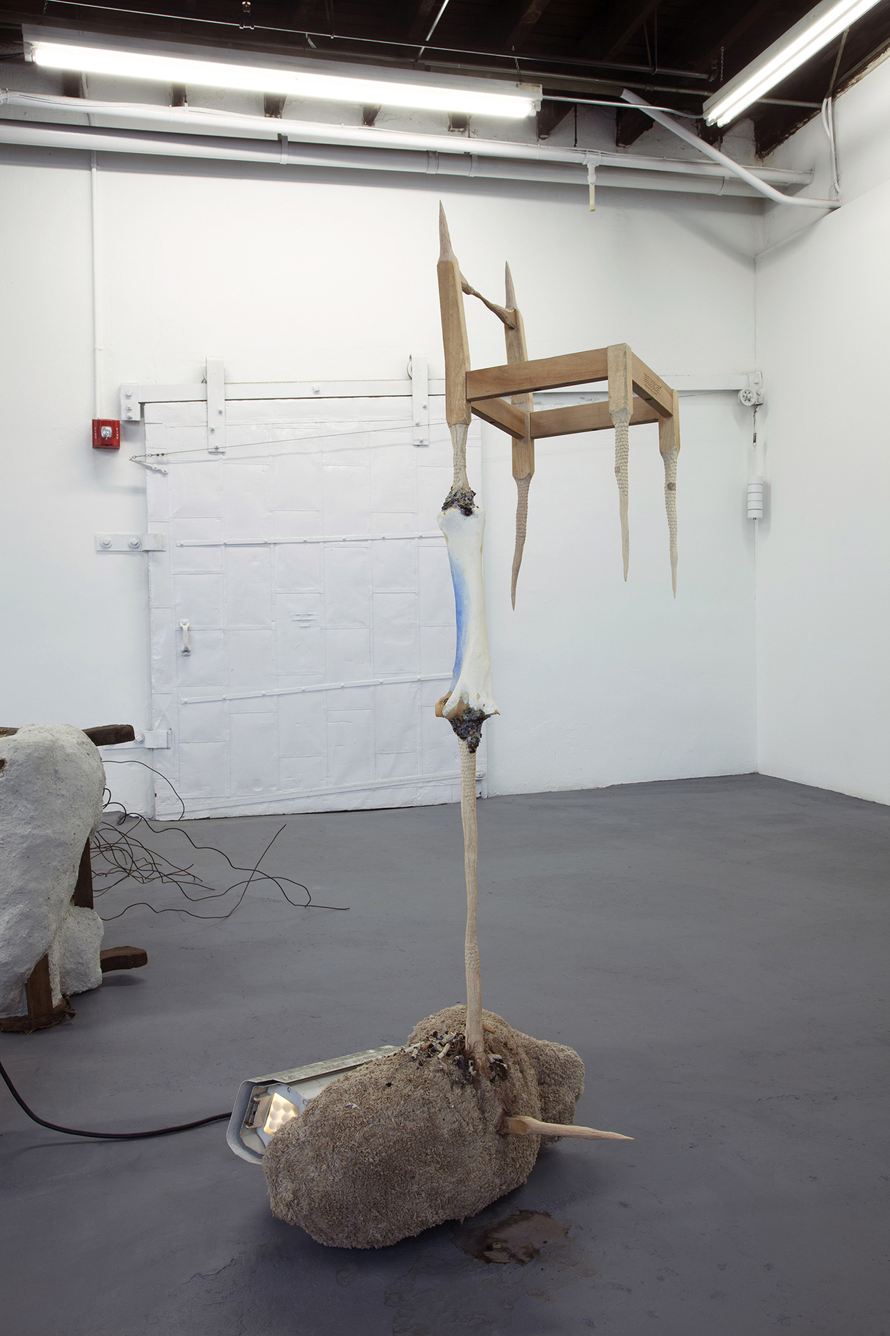 risk assessment (by what love have I) 2020 abandoned chair, horse tibia, steel, plaster, carpet, traditional Chinese sleeping medicine, pigment, horse hair, glue, water, cigarette butts accumulated from December 2019 to February 2020 68 x 23 x 27 inches