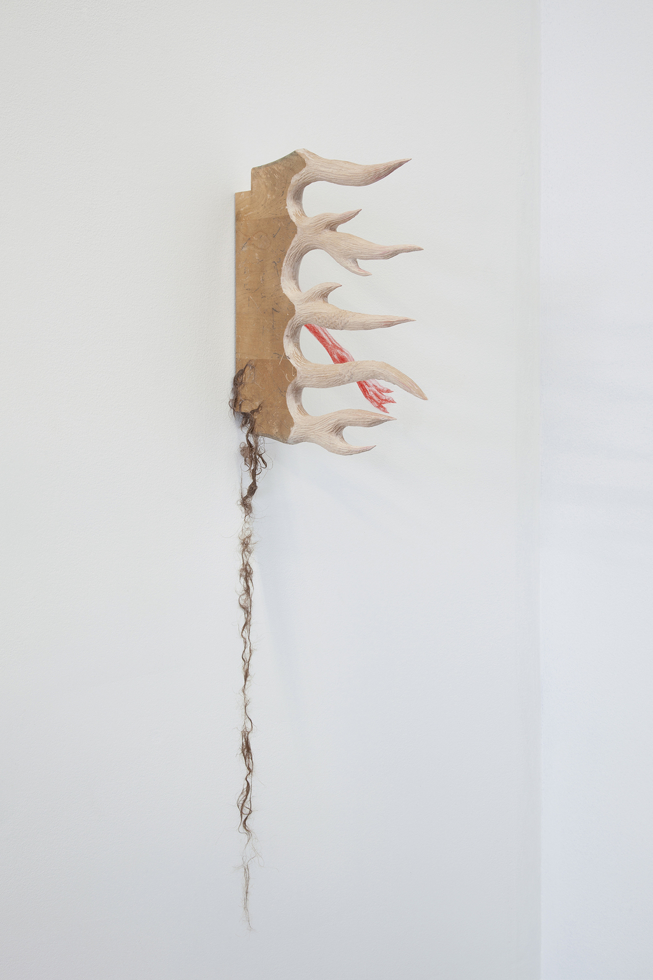 translatio (…under the, under the porch of the house? At the last moment... It... yelps. As if it’s seen something real.) 2020 abandoned chair seat, horse hair, glue, red polymer lead 12 x 12 x 10 inches