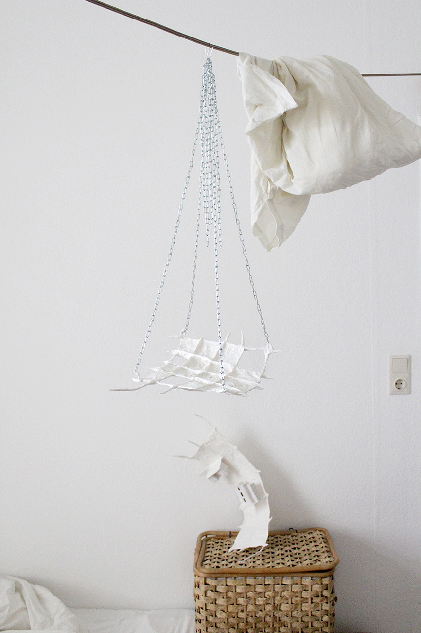 Anna Bochkova, Lullaby 2020, sculpture, wire, paper, plaster, chains, 100x40×30cm + Utopia, 2020, wire, plaster, paper, plaster, cardboard, 50x20x5cm (Kvartirnik installation view)