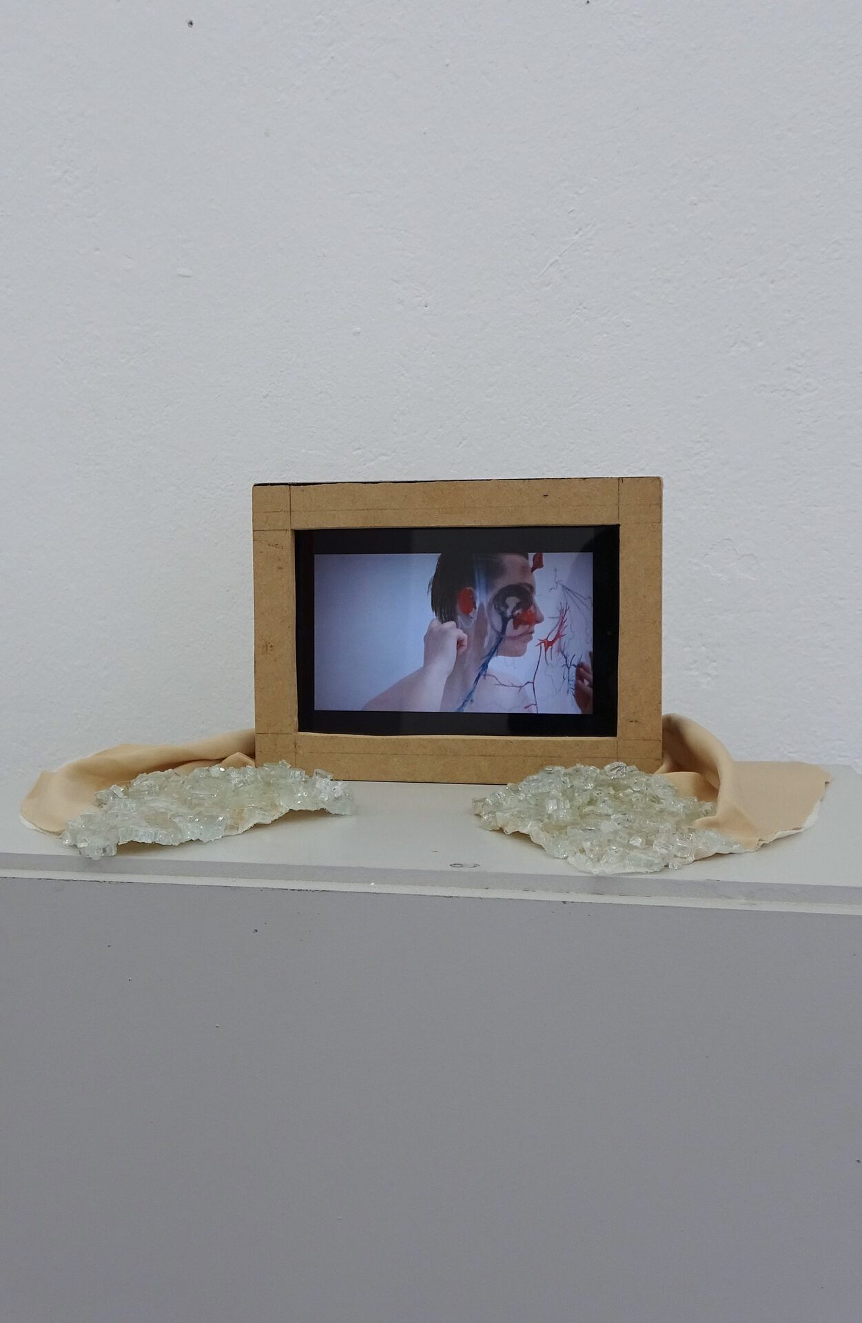 Monika Dorniak, Past Pieces Merging With What I Call Now, video installation with glass, wood and fabric, 30 x 20 x 5 cm