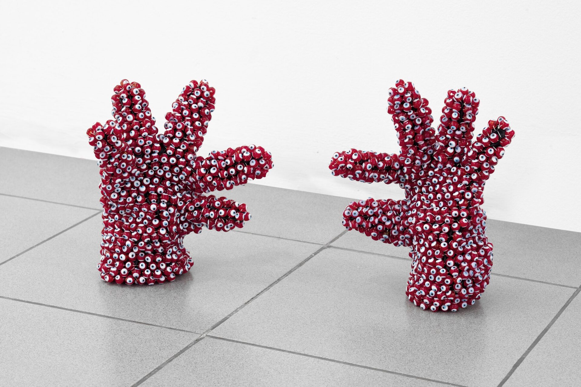 Red Hands, 2016-17, gloves, evil eye beads, thread
