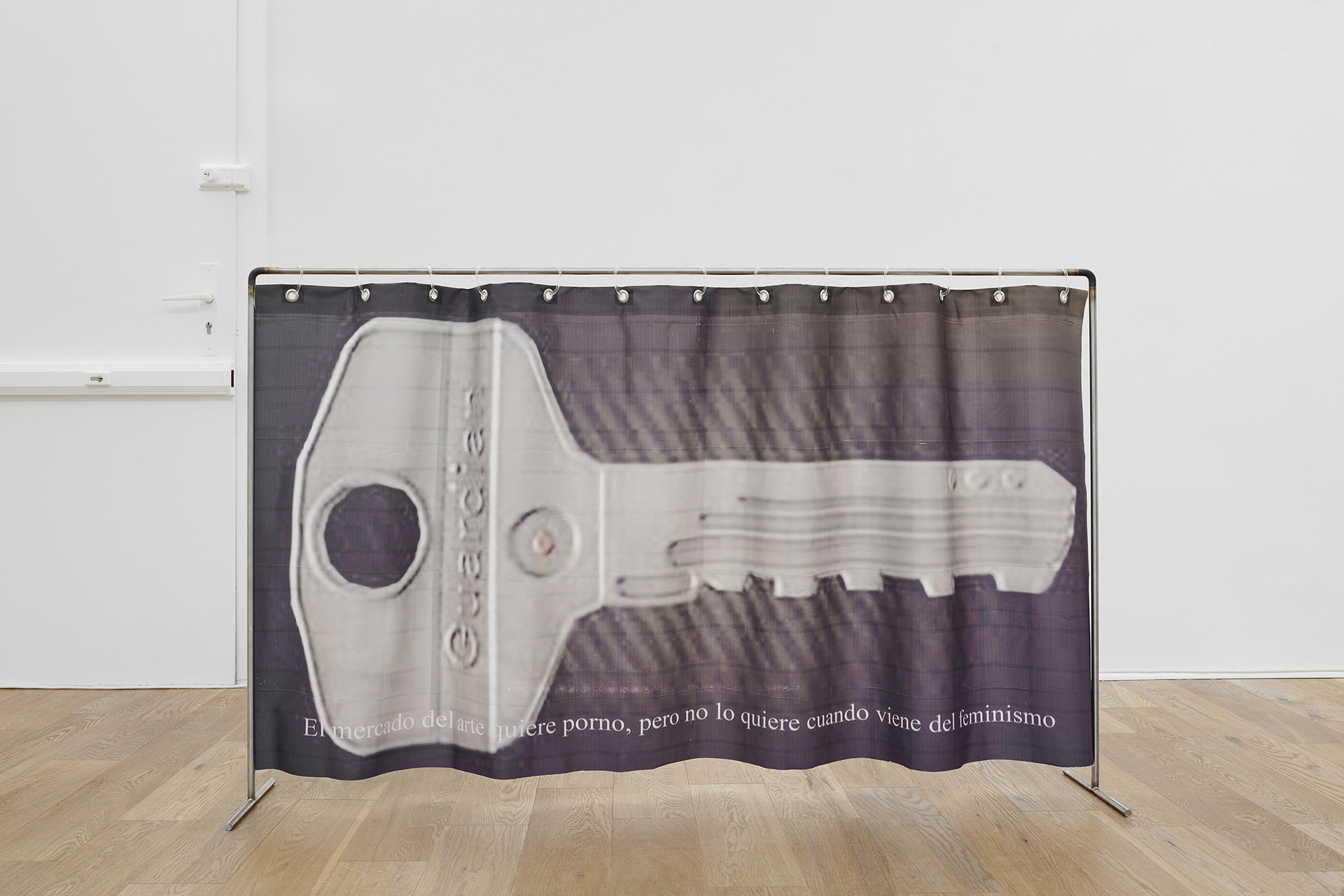 Andrey Bogush, Guardian (The art market wants porn, but it doesn’t want it when it comes from feminism), 2020, UV print on curtain, eyelets, PVC hangers, steel rack, 100 x 160 cm