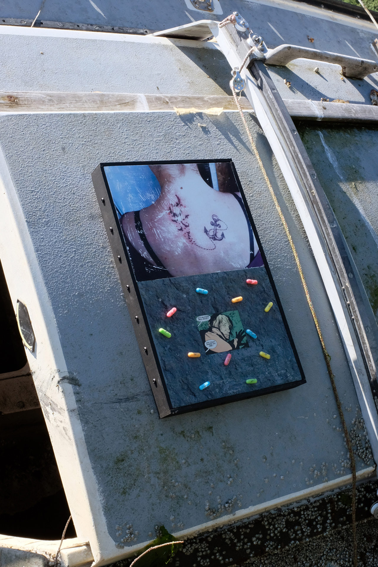 Graham Wiebe, Anchor, 2020, laser print on panel, comic strip, foam animal capsules, artist frame, 10.5 x 14 in