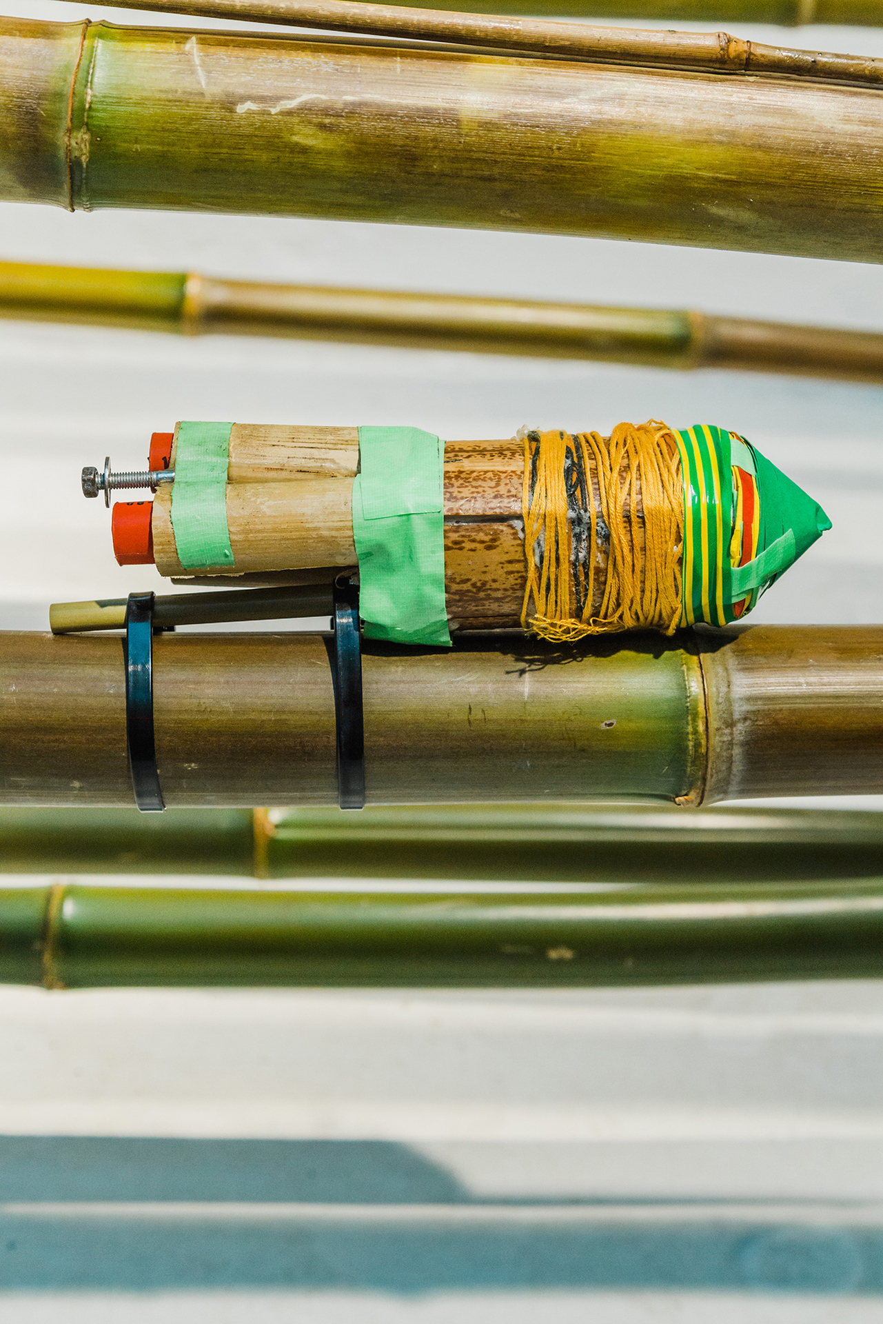 Monika Czyżyk in collaboration with Finnish Astronautical Society,  Geographies of a lonely Pole (Cluster - Bamboonaut 3 - Bamboo Rocket), 2020, bamboo tube, 3 x D9-7 motors, tape, cardboard, thread, screw, zip ties, detail