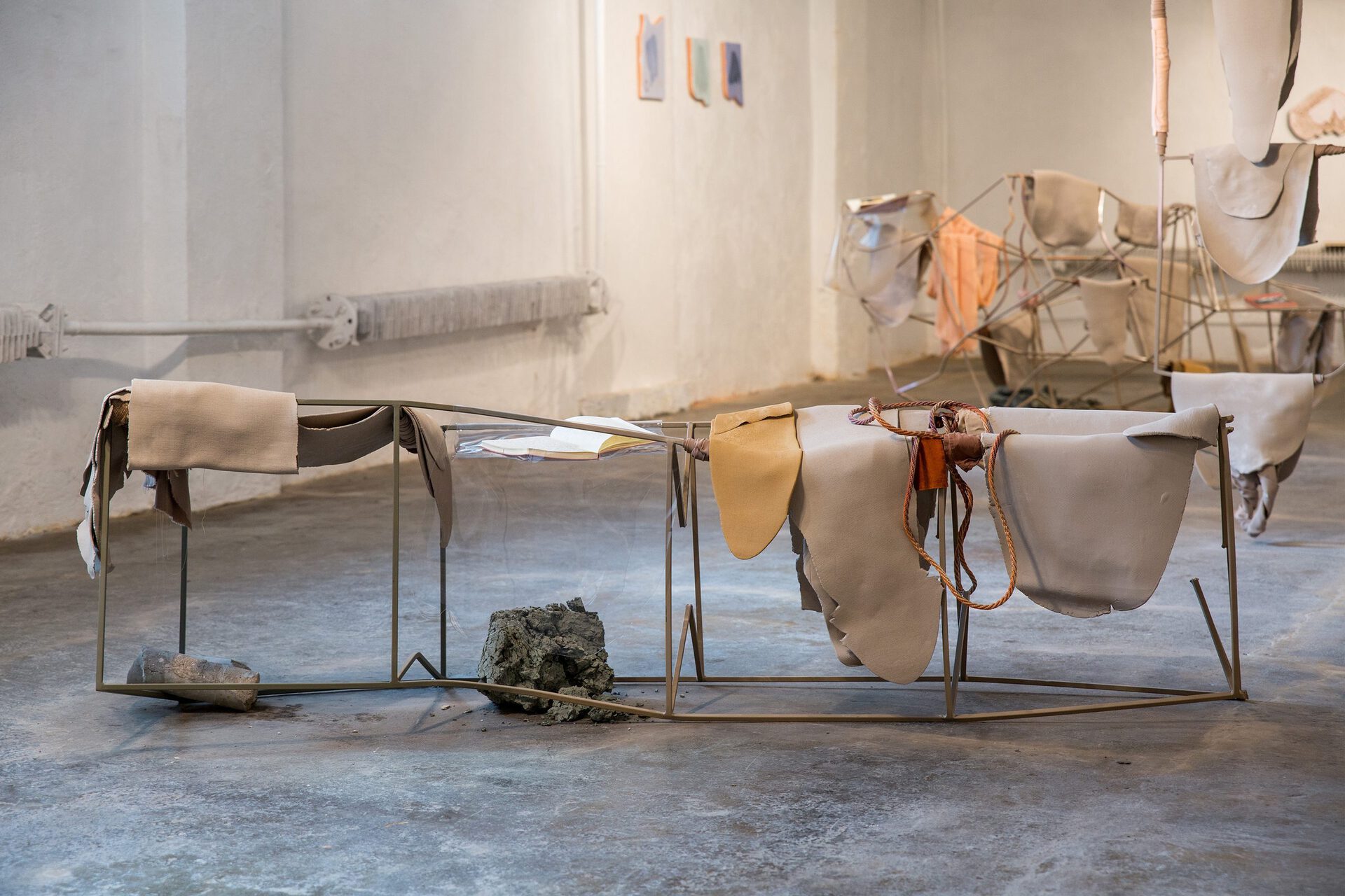 Laura Põld, Lying on the ground, 2020. Steel, clay, textile, found objects, rope, plexiglass, spray paint