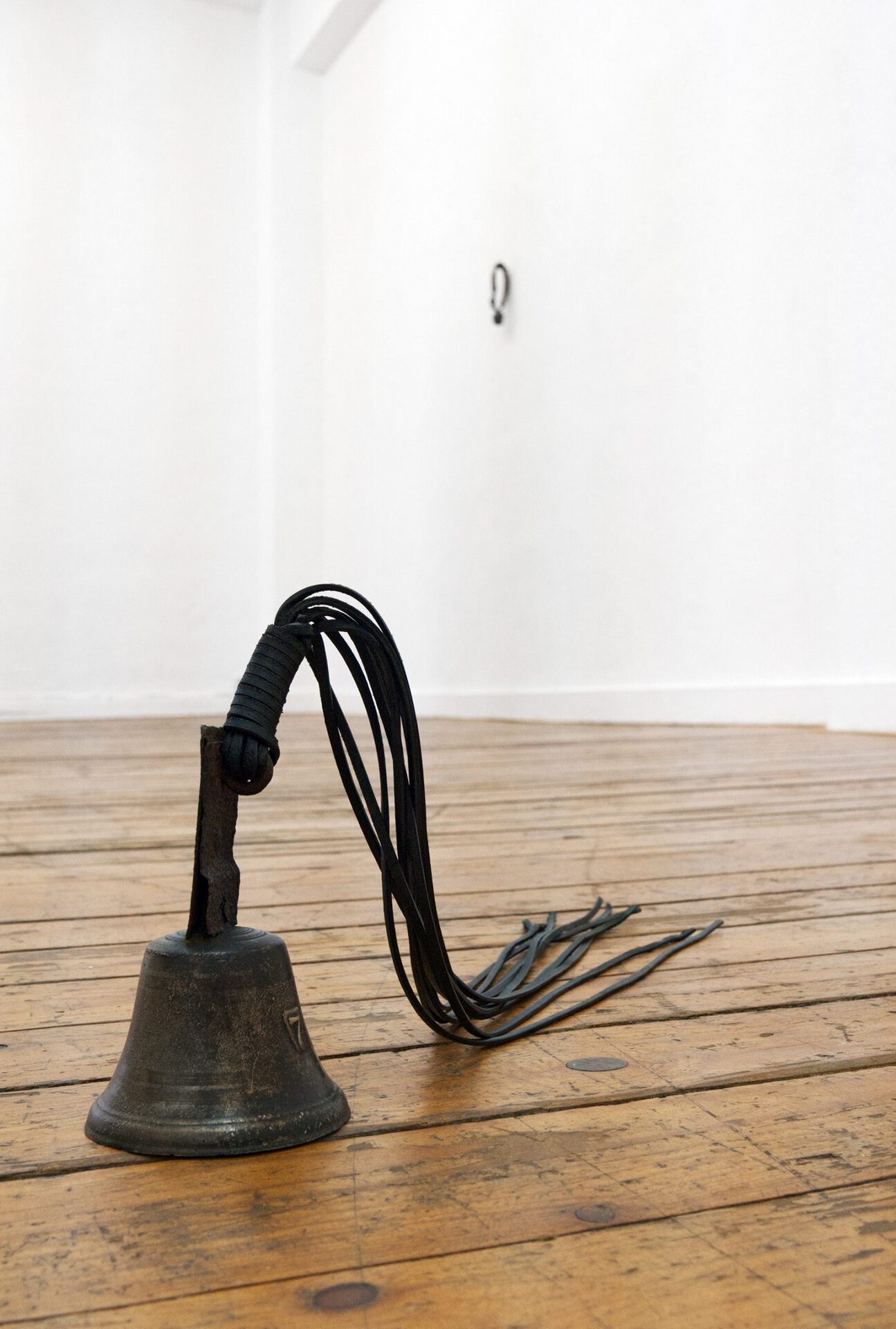 Eliza Ballesteros, DOMESTIC HECK IV, 2020, antique bell with laces, brass, iron, leather, 20 x 55 x 14 cm