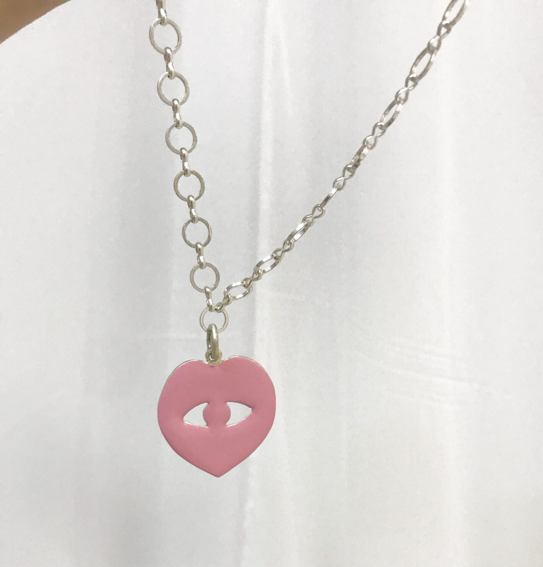 Valinia Svoronou, A toss of her Neck, Edition of 10 Silver adornment with pink ceramic glazed metallic chain, 2020