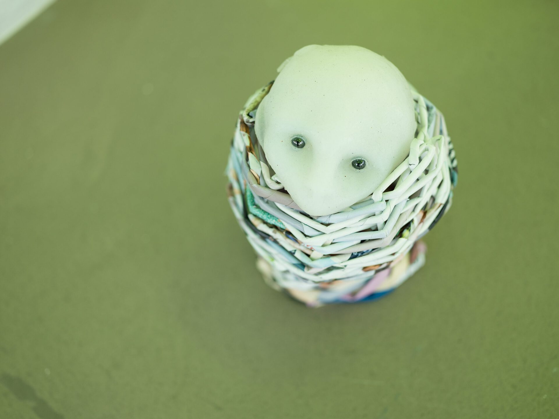 Aniara Omann, Lillebror (Little brother), 2020 Recycled maternity clothes magazine.  Cast gel-10 silicone. Hematite stone.