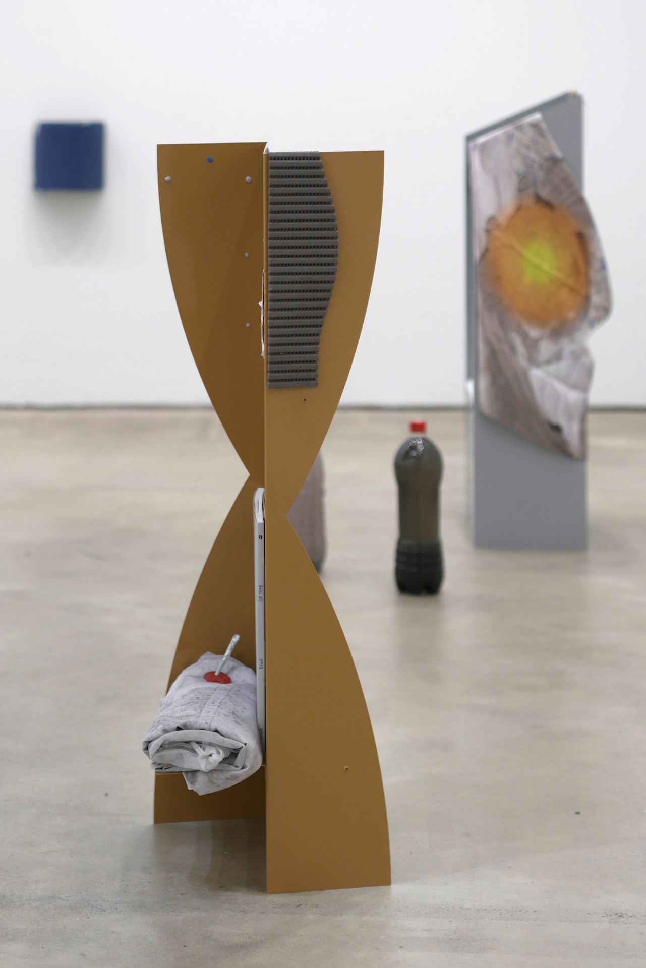 Stand byes and farewells (Pace of While) 2020, powder-coated steel, blue tack, hand printed fabric, Paste of Time book, candies, cigarette rolled with flowers, wooden utensil, dried apple, lottery form