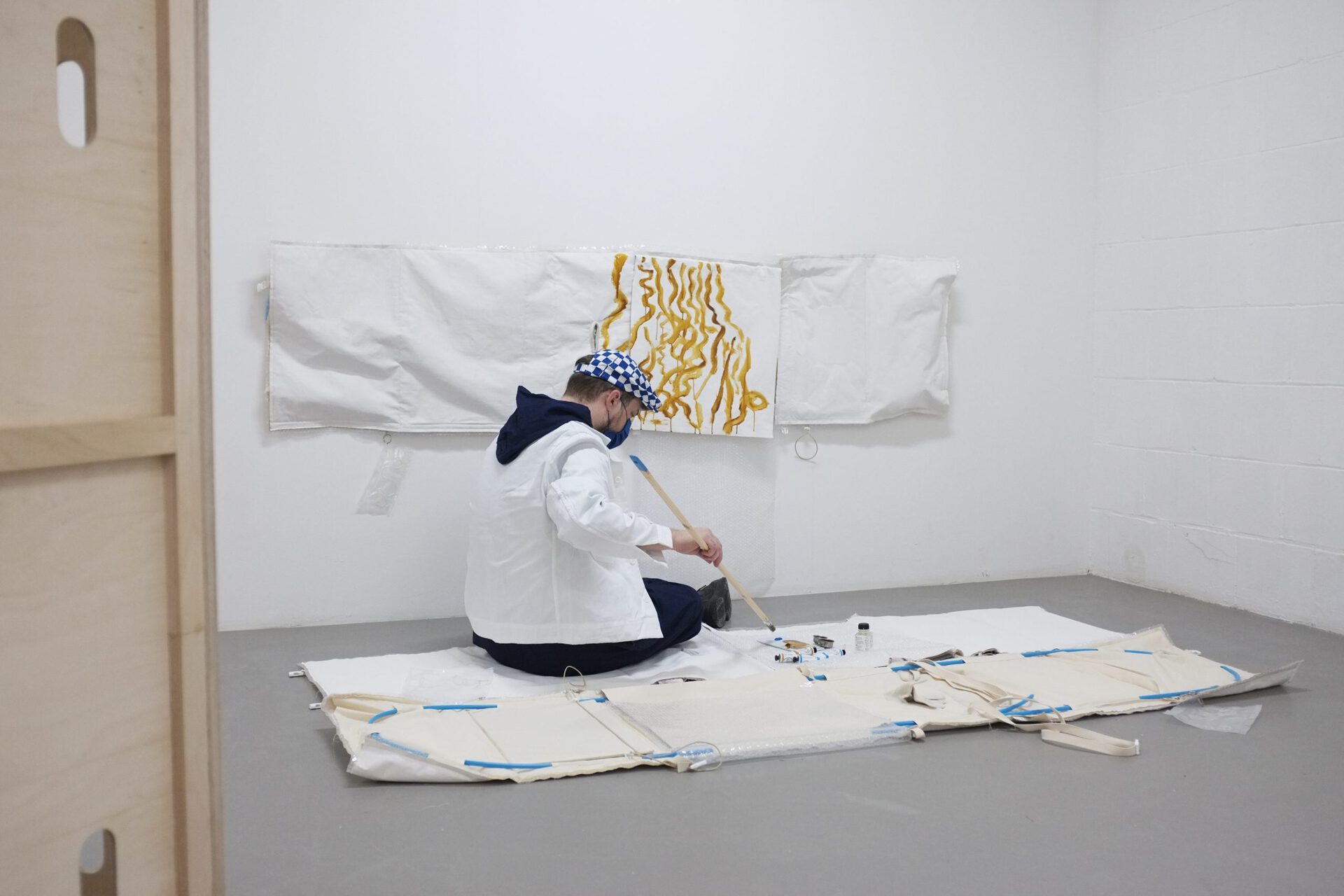 Kaspars Groševs - artist and founder of 427 Gallery - participating in the exhibition Artist Crisis Center II: Tact Gear as ‘artist in crisis’. Photograph by P/////AKT.