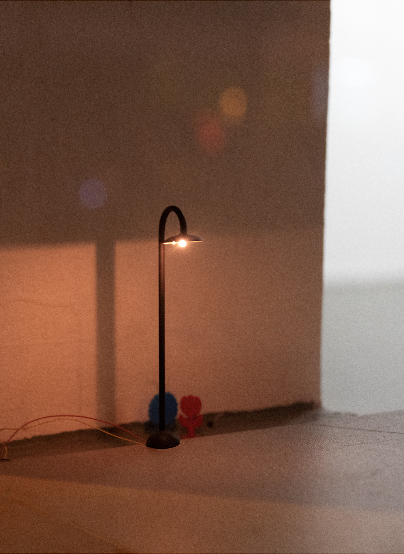Giovanna Belossi & Francesco De Bernardi, Untitled (Inosservato), 2020, miniature streetlight, toy flowers, 12 cm
