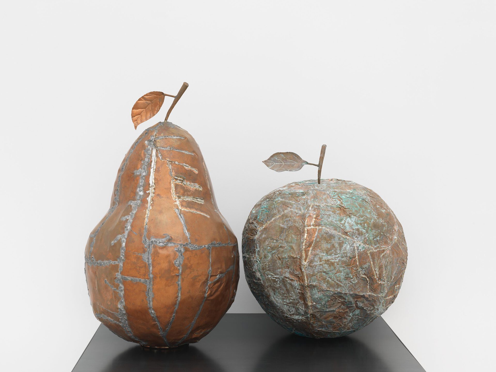 Lucia Leuci, La butteratura amara della mela, 2020 Copper, tin, verdigris, 60x52 Ø cm +
Lucia Leuci, Pera da ramo potato in sintonia con i cicli cosmici, 2020 Copper, tin, 73x52 Ø cm