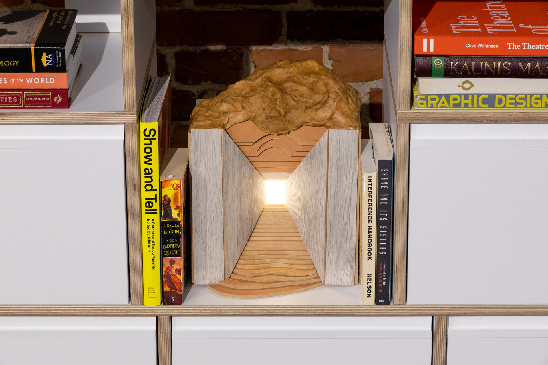 Lukas Malte Hoffmann, Study with corridor and and bob, 2020, wood, wax, lamp, books (‘The Earthsea Quartet’, ‘Shame and its Sisters’, ‘Show and Tell- A Chronicle of Group Material’, ‘The Interference Handbook’), 32x25x19cm