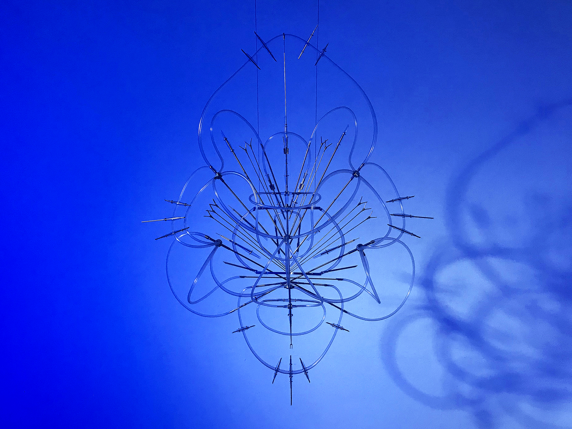 Floryan Varennes, Iris(détail 1), 2020, Medical tubes, medical instruments, blue light; 100 x 130 cm