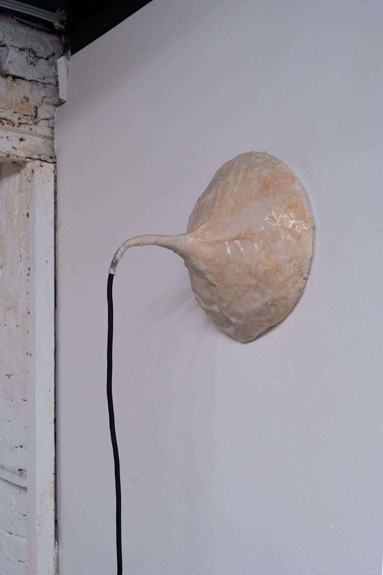 Alina Brovina, Connector I, 2020, 450 cm. cable, mounting foam, cellulose foam, tone cream, silicone, electric three-core cable, 40x35x35 cm.