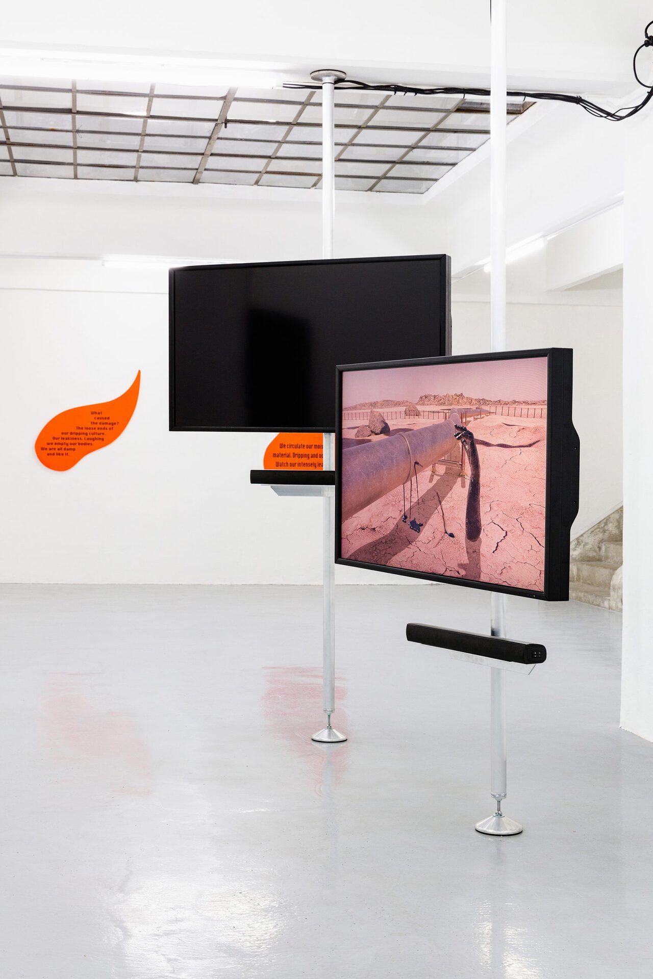The Leaking Bodies Series, 2020, 3 channel video installation, 06:30 min, sound, loop, animation, orange acrylic glas, black vinyl installation view, Gianni Manhattan, Detail