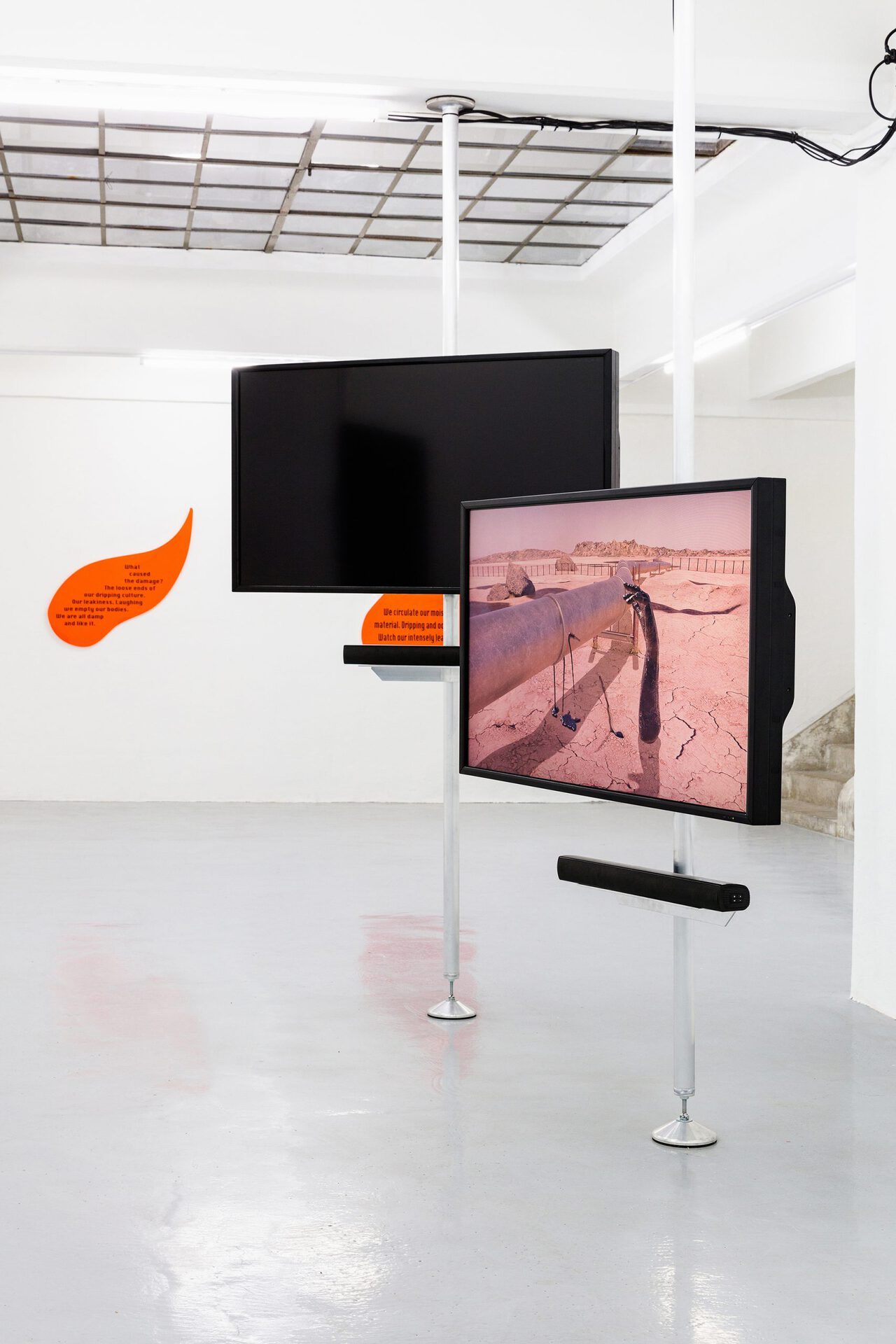 The Leaking Bodies Series, 2020, 3 channel video installation, 06:30 min, sound, loop, animation, orange acrylic glas, black vinyl installation view, Gianni Manhattan, Detail