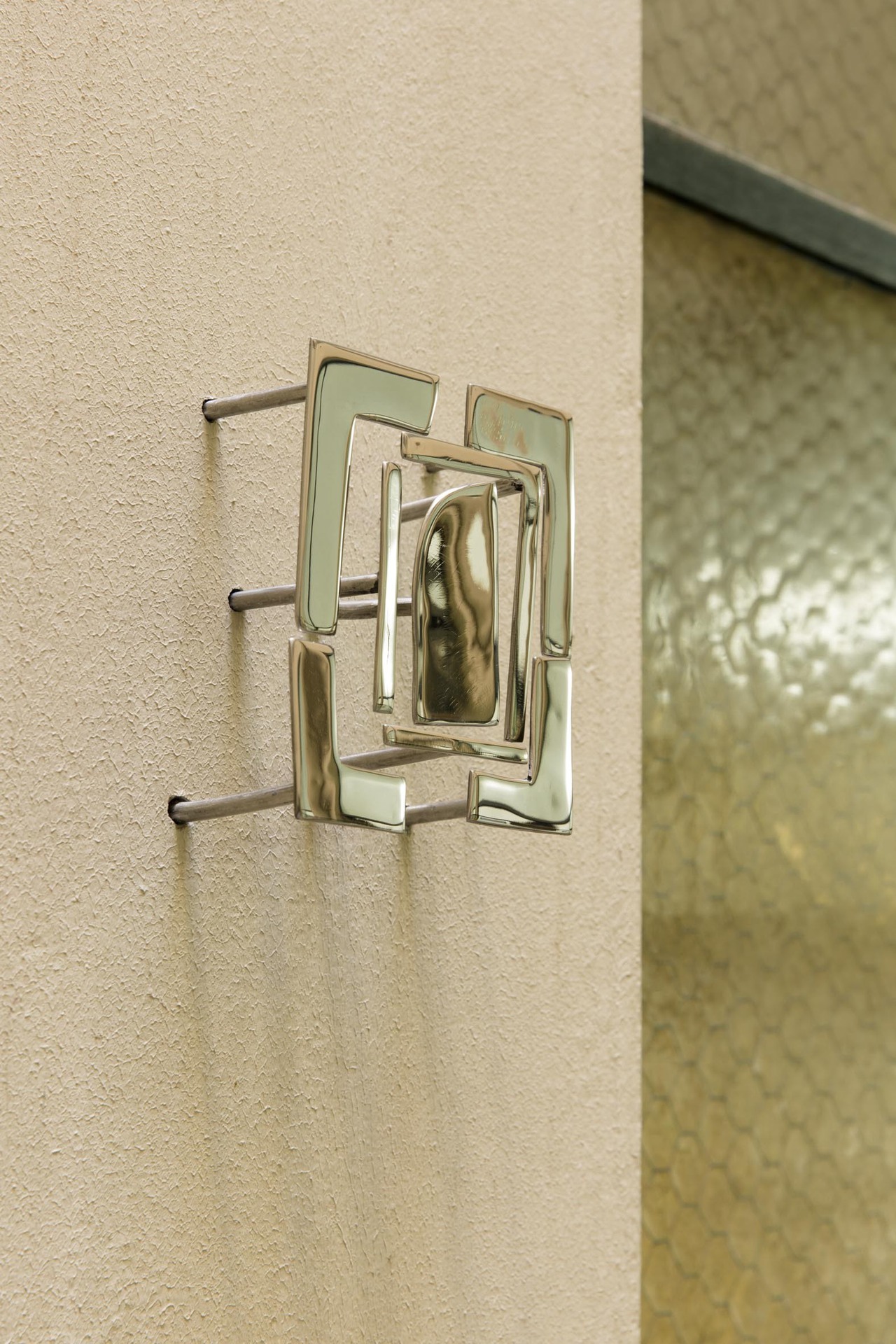Augusta Vinall-Richardson, An Overview, 2021 Polished stainless steel, wall. 12.5 x 14 x 7cm.