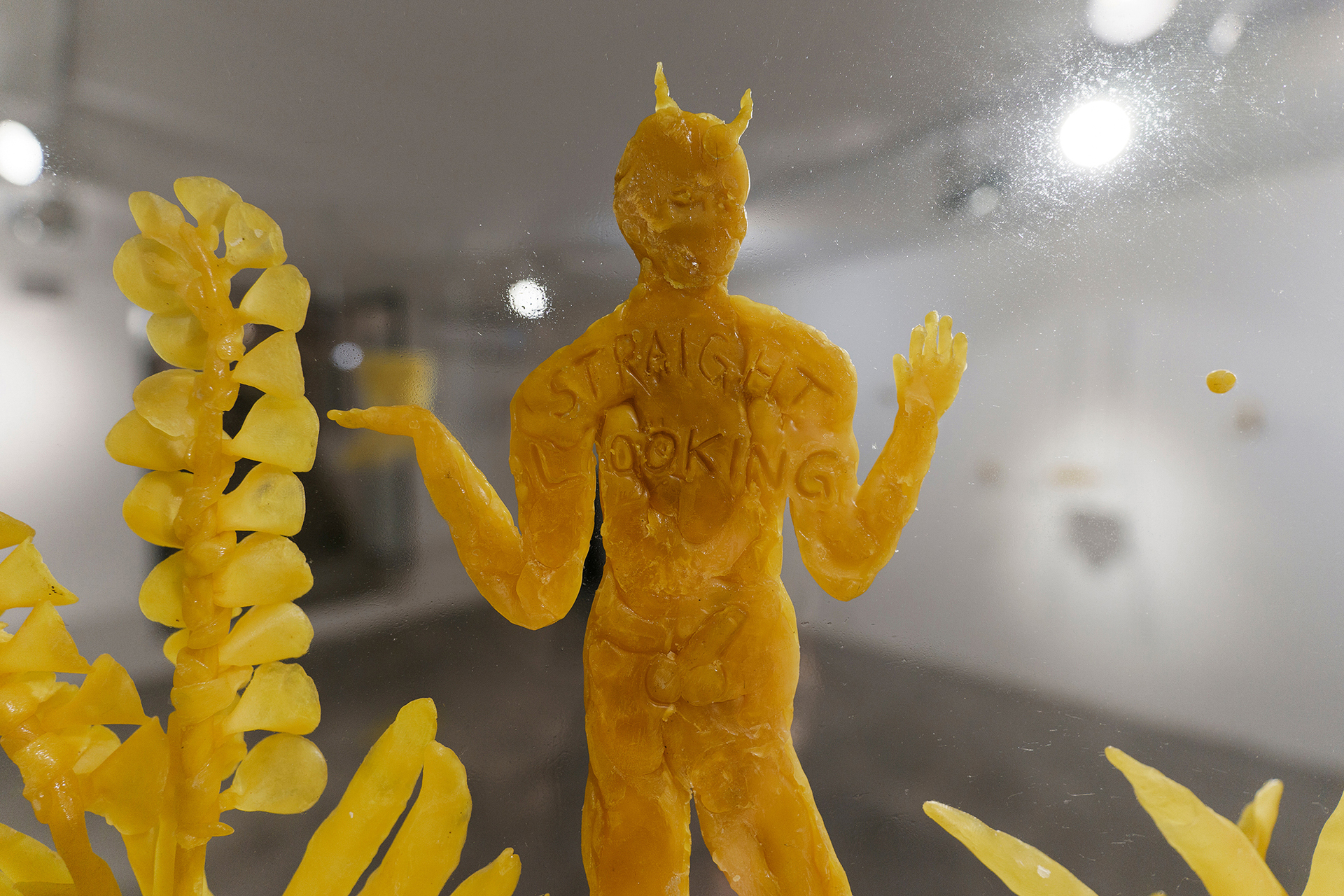 Gideon Horváth, Faun with a hard on looking into the advanced future, 2021, beeswax, glass, 100x50 cm, detail, photo by Dávid Bíró