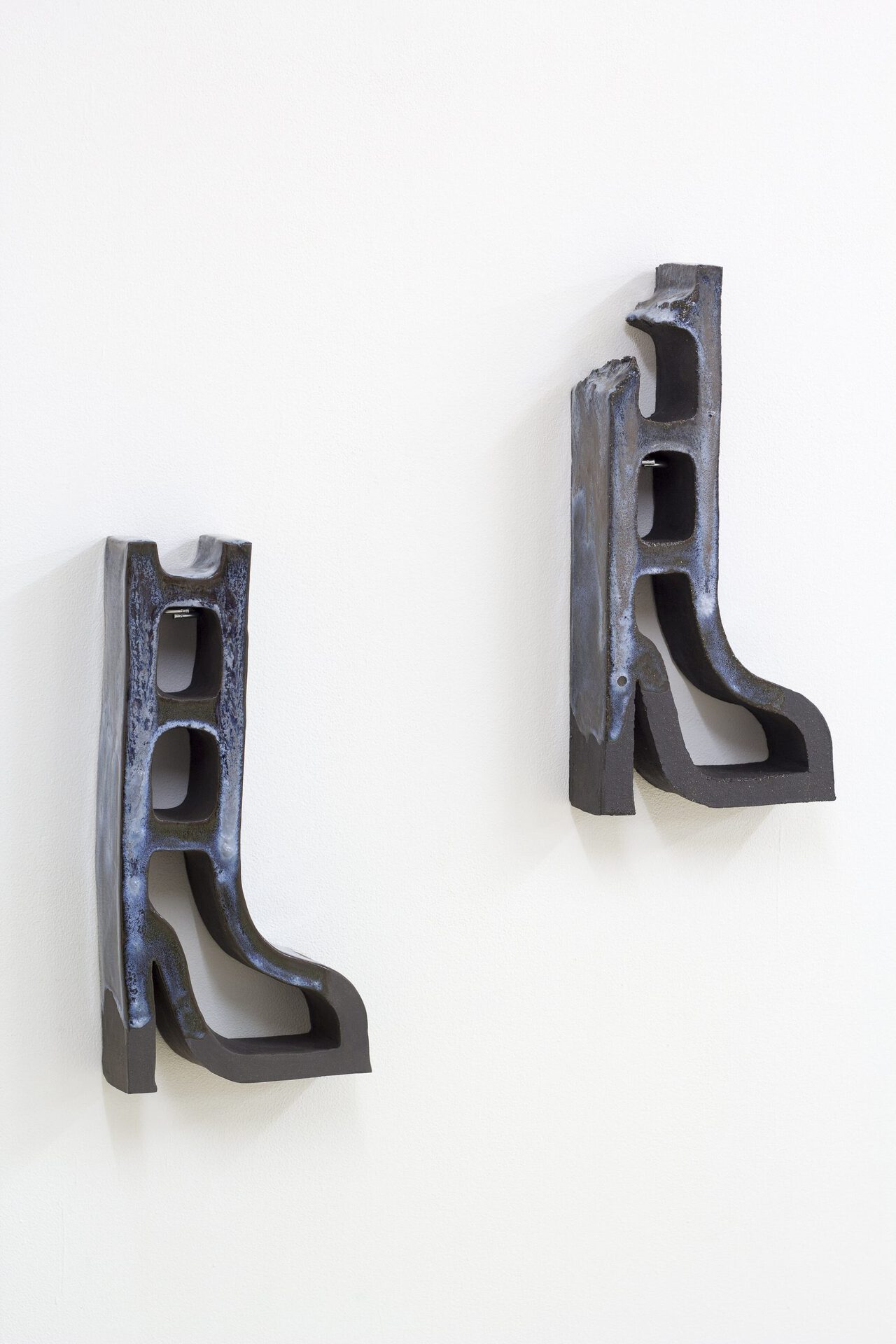 Paloma Proudfoot, Breeze boots I, II. Glazed black stoneware, 2020