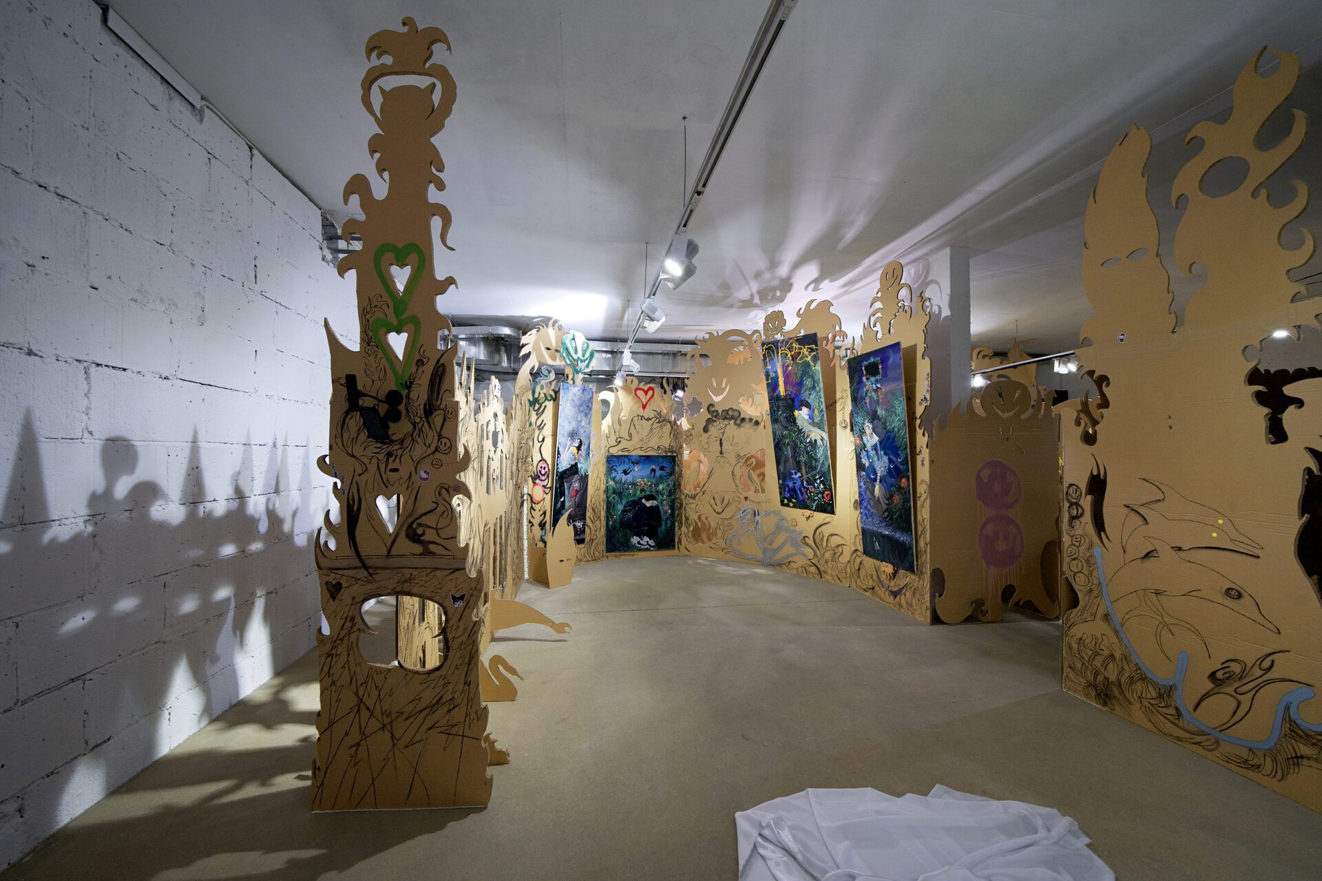 Vladimir Kartashov, the fragment of the show "Innocent pranks. Technorococo", 2021, mixed media, cardboard, paintings, approx. 12 sq m.
