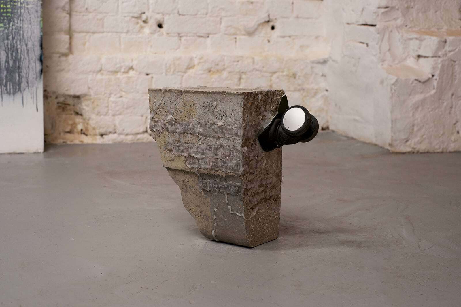 Daria Makarova, Il n'y a de cause que de ce qui cloche, 2020, concrete, building sealant, dust, wrapped poetic text, food-grade silicone, orthopaedic chair wheel