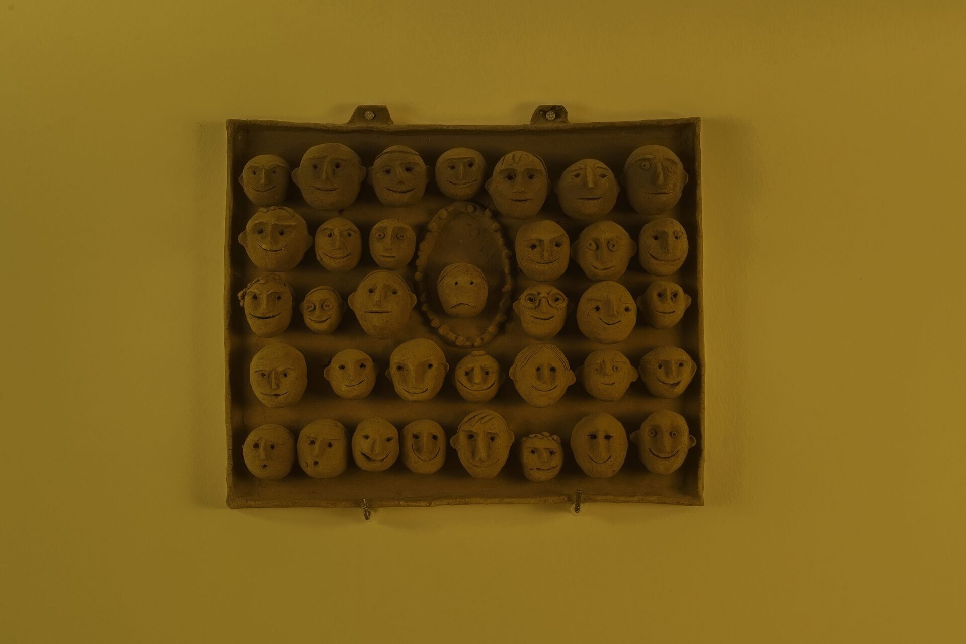 Siona Shimshi, Class Picture 1939, 1965. Clay, 30 × 35 × 3 cm. Photo: Liat Elbling.
