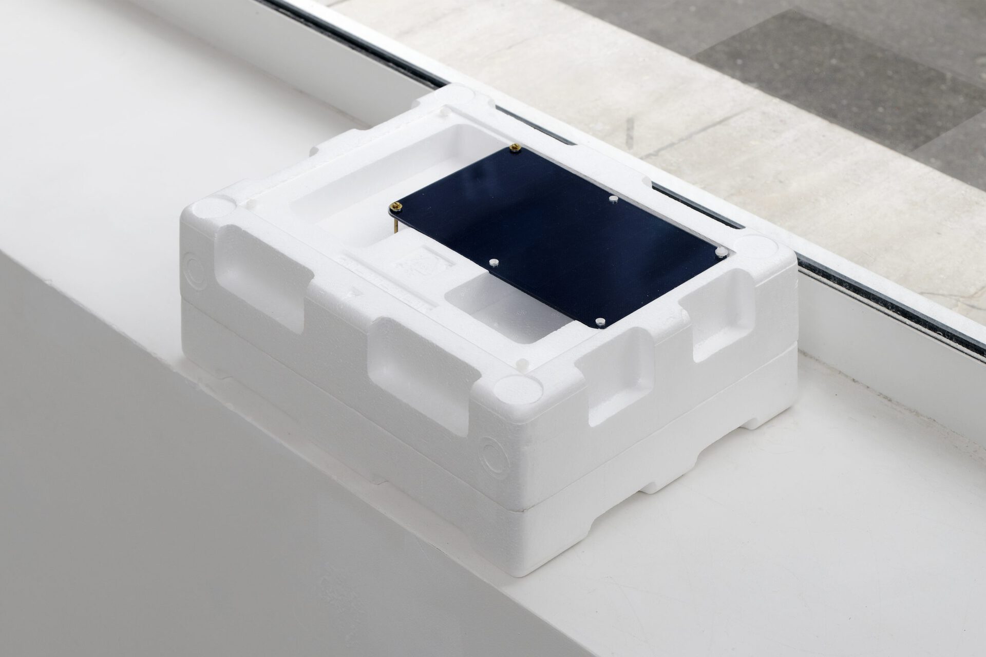 Christophe Lemaitre, Untitled. Photovoltaic surface, inverter, battery, electronic cards, wifi, automated video and remote image capture script, polystyrene, pmma, 29 x 37 x 14 cm
