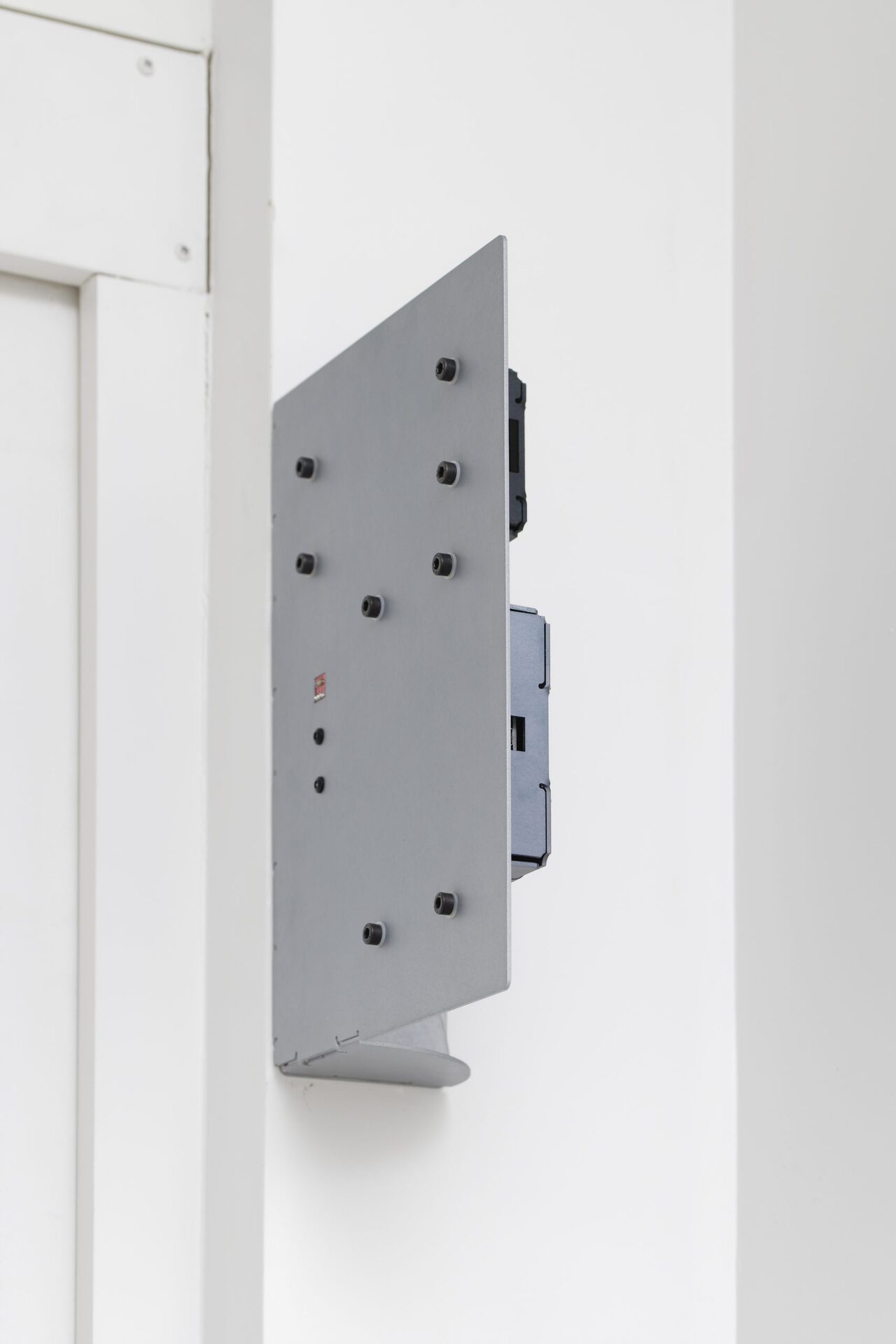 Christophe Lemaitre and Kim Farkas, Untitled, 2017. Folded and pierced aluminum plate, electronic card, artificial neural network, charger, battery, daylight sensor, diodes, connectors, 21 x 30 x 9 cm