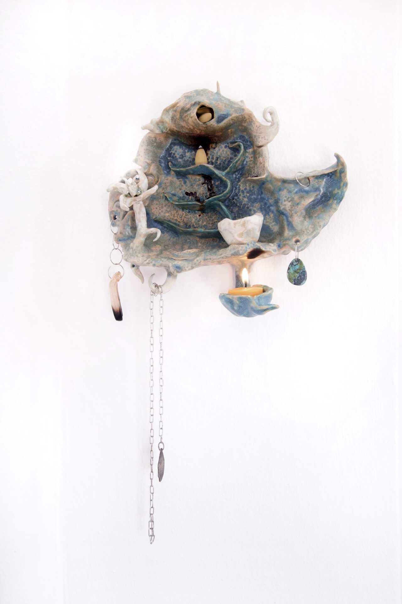 Maya Hottarek Facing a Young Padawan 2021 Glazed ceramic, palo santo, essential oils, beeswax, chrysocolla, metal, lighter, water