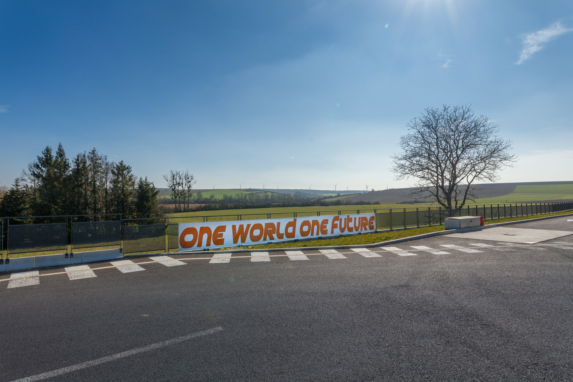 Zuzanna Czebatul, One World One Future , 2021, print on PVC tarp, 90 x 1000 cm.