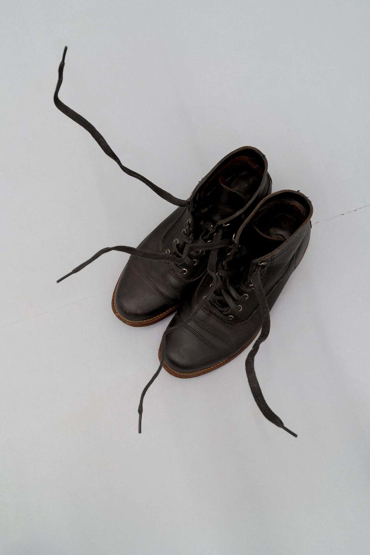 Vitaly Bezpalov, My feet have taken root in the soil forming a perennial vegetation as far as my belly, and filled with vile parasites. Disastrous Life. My heart is still beating, 2021, Wolverine 1000 Mile vintage boots, wire, detentions vary