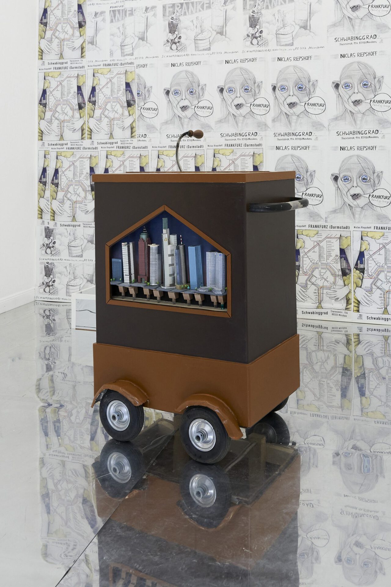 Niclas Riepshoff, Skyline Organ (Frankfurz), 2021, customized barrel organ, brass pipes covered with architectural models made from cardboard, aluminum foil and acrylic paint, customized punchcard „Wind of Change“, 100 x 80 x 60cm