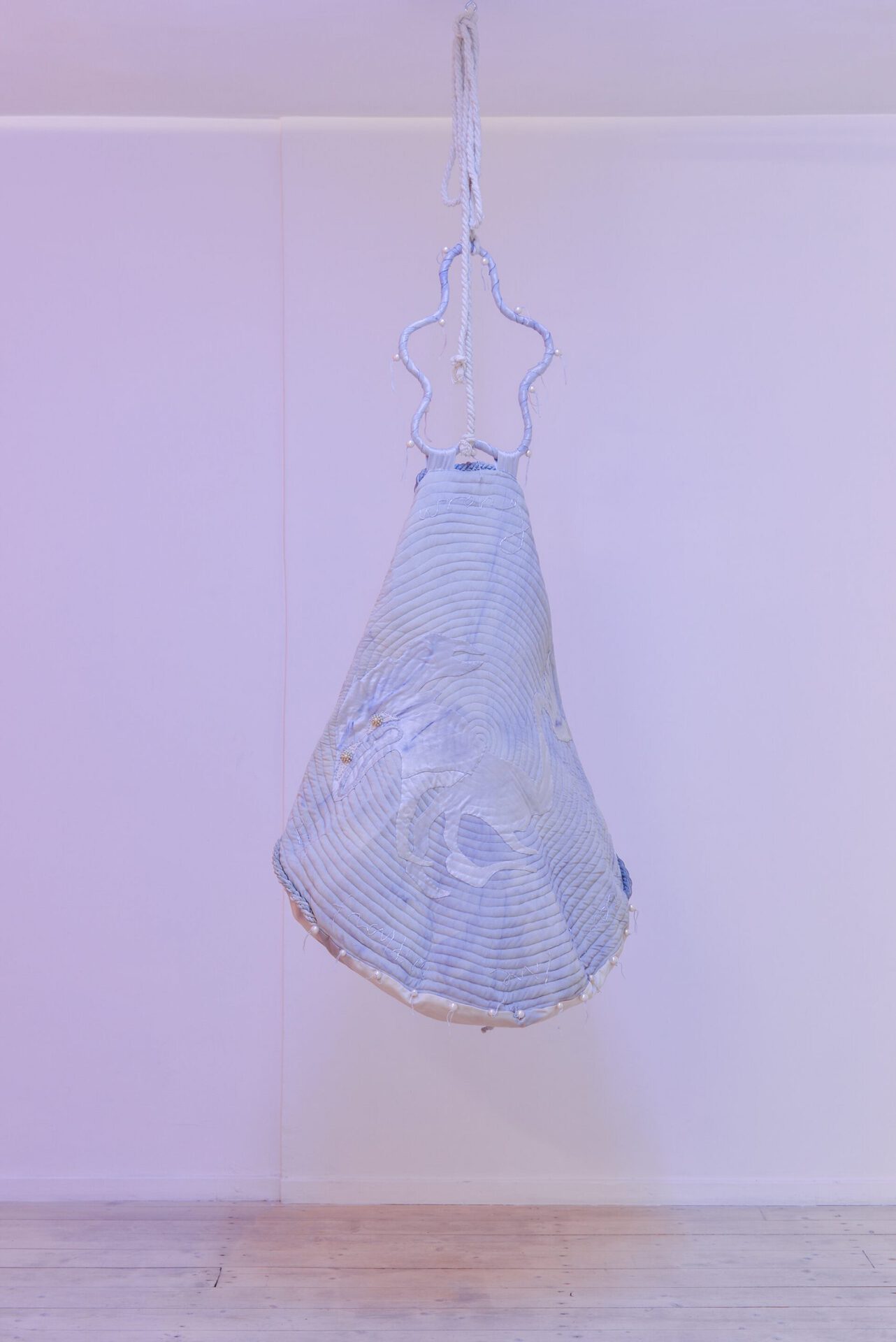 Anna Reutinger, I was wrong and I just can’t live without you, reliquary purse #1. Black beans, silk, faux pearls, steel, hair cut from each others head over 1 year, 2021
