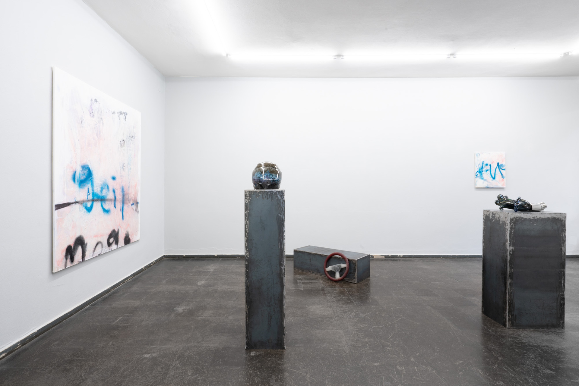 Installation Photo from the series Pleasure Drive From left to right:   ALANA LAKE, Mega Geil, 2020,  Emulsion, pigment, spray paint and epoxy on canvas,  180 x 160 cm  Black and Blue, 2019 Cast Glass, hand polished,  22 x 35.5 x 24 cm  Free Wheel, 2021 Cast Glass 35 X 35 cm  Fuck, 2021 Emulsion, spray paint and epoxy on canvas,  60 x 50 cm  Smokin’, 2020 Metal and hand blown glass 40 x 17 x 15.5 cm