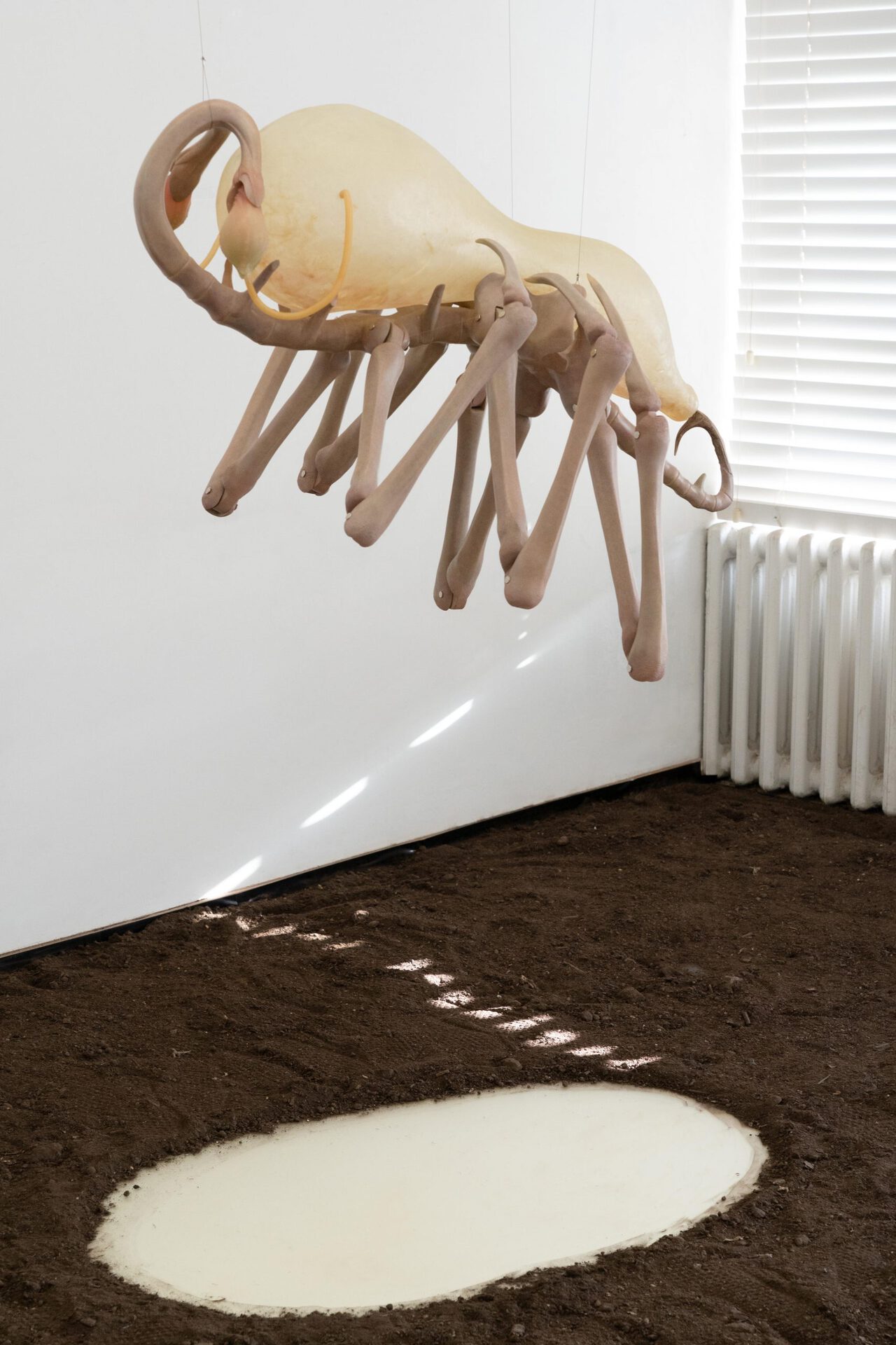 Liao Wen, Blind Hunter,2021,Lime wood, Silicone, Epoxy resin, Rubber tube, Antler, Smelling salts, Flocking powder,98x85x70cm