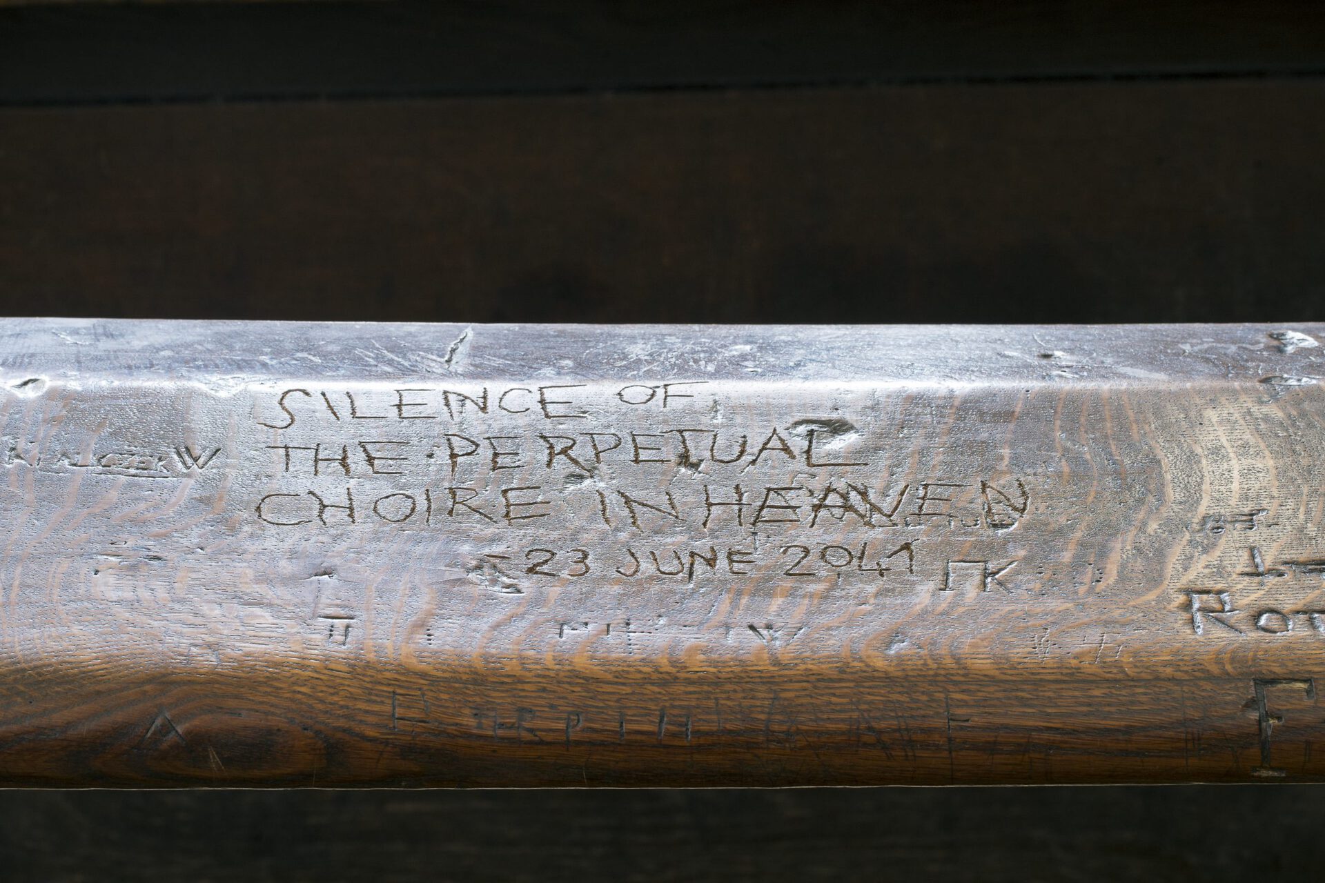 Ed Atkins, Untitled Anonymous, 2021 hand-engraved inscription “silence of the perpetual choire in heaven, 23 June 2041” on a wooden church pew