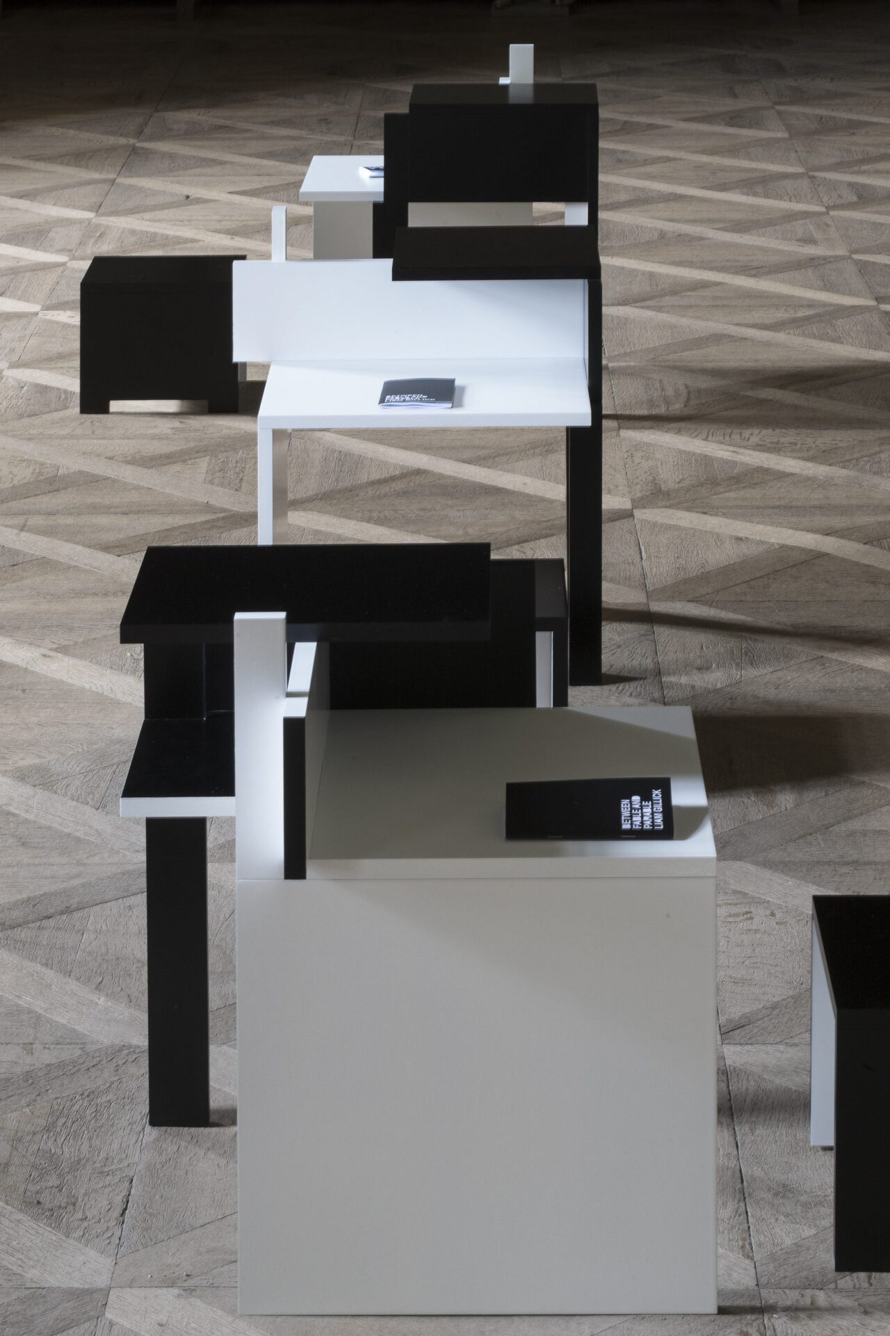 Liam Gillick, Three Borrowed Gray Rotations, 2021 painted lacquered MDF 65 × 50 × 50 cm (desk) 25 × 30 × 30 cm (stool) detail courtesy of the artist and Galerie Meyer Kainer, Vienna