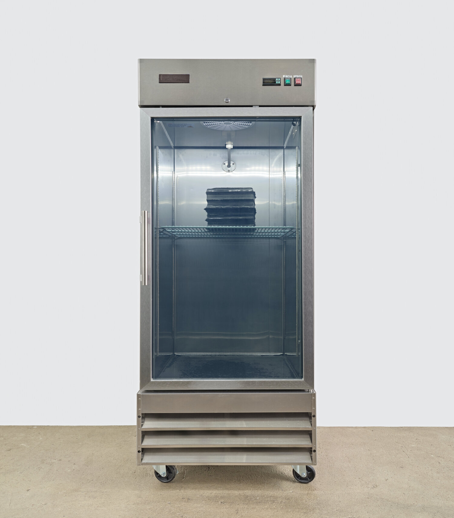 Sae Jun Kim Solicitude in stratum’s loss, 2021 commercial freezer, water, carbon sediment  82 x 29 x 34 inches (208 x 74 x 86 cm)