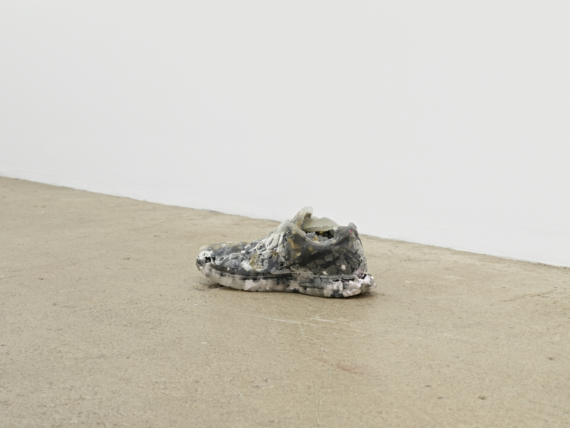 Jeenho Seo “New” shoes, 2021 (left) artist’s worn sneakers, epoxy resin 6 x 12 x 5 inches (15 x 31 x 13 cm)
