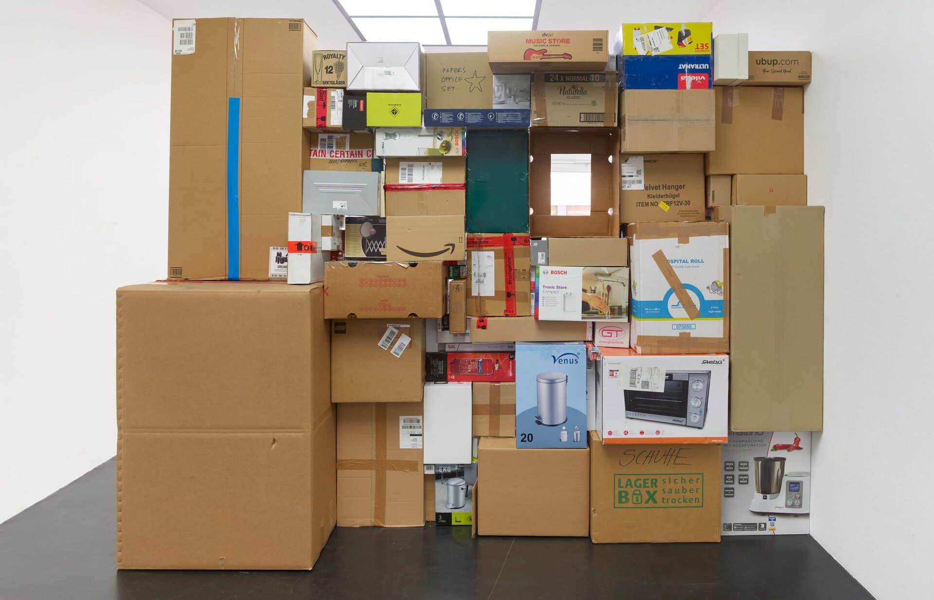 Rosa Aiello, 24 Normal 10, 2021 85 collected cardboard boxes, book, 231 × 290 × 57 cm