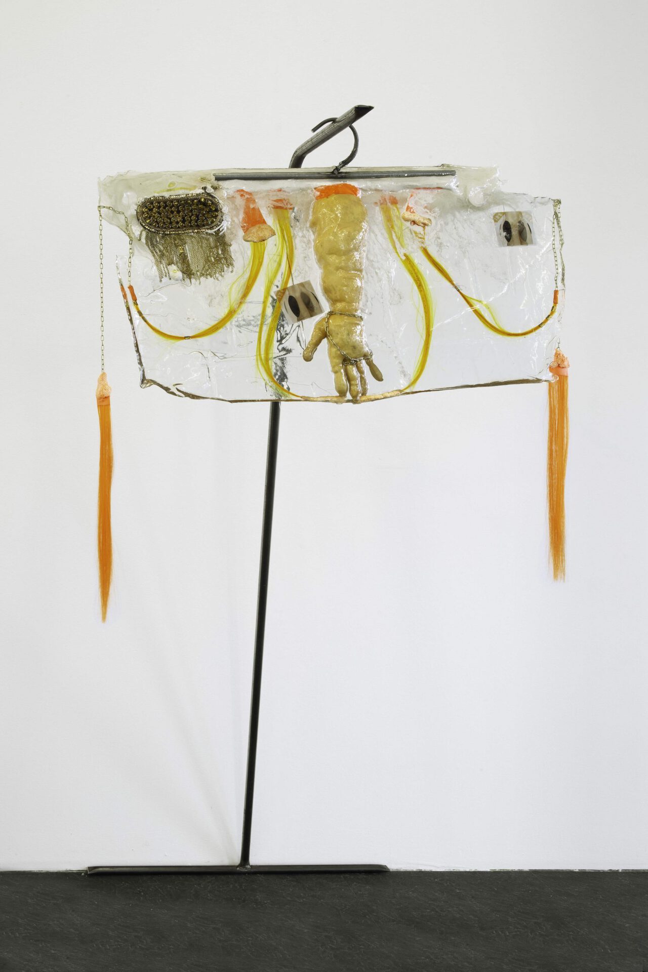 Theresa Weber, Glove, 2020, glove, synthetic hair, modeling clay, tape, chain, prints on paper, rivets, pigment in polyester on metal