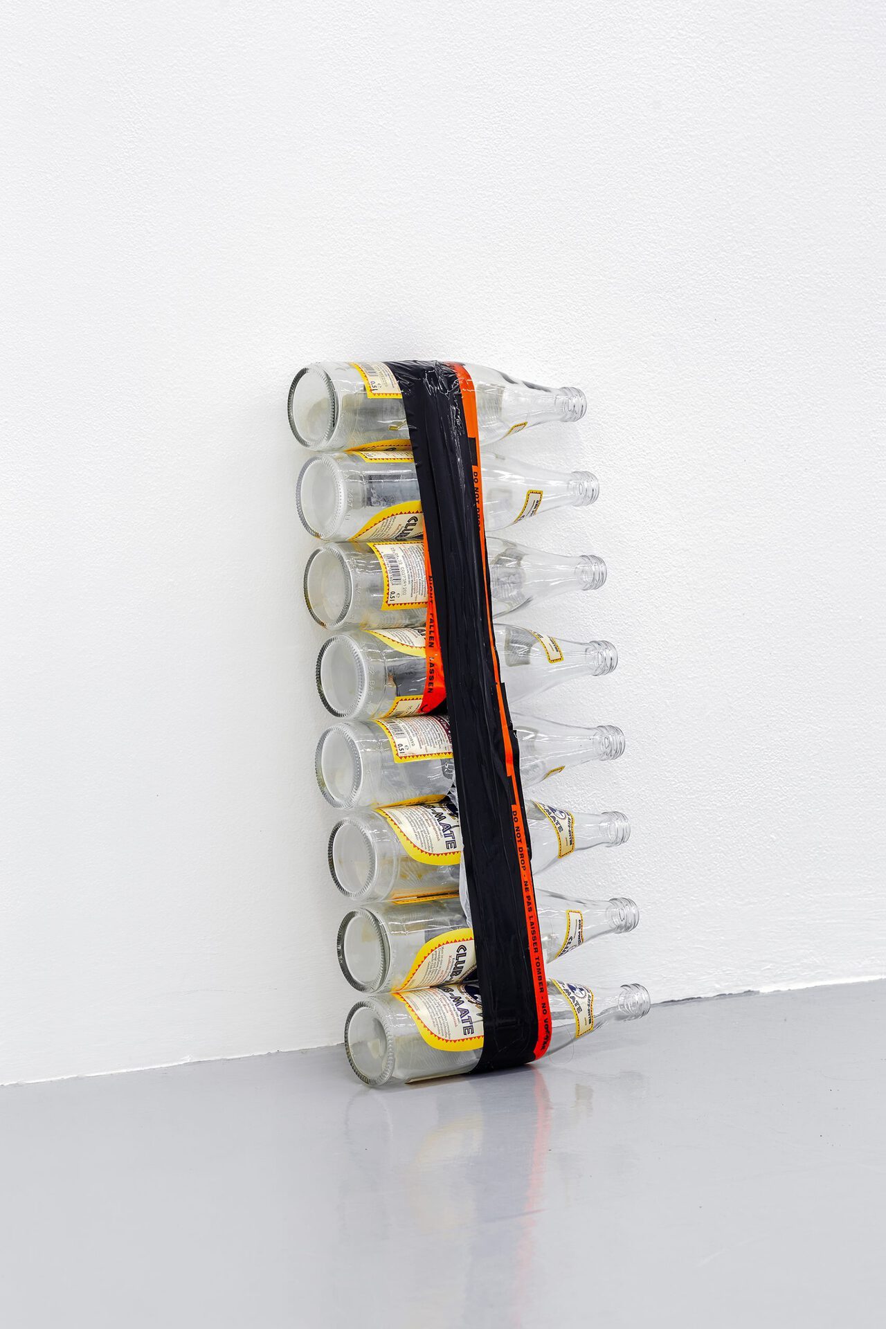 Snake Charmer I, 2021, Club-Mate bottles, wood and packaging tape, 52 × 24 × 6,5 cm