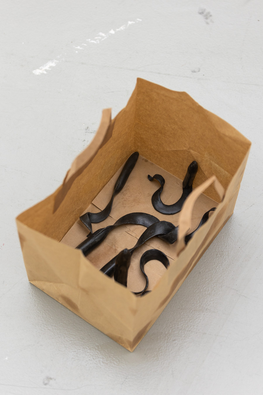 Kate Fahey, swimmers (detail),2021, bag,oil, state stone, bio resin, 30x20x20cm