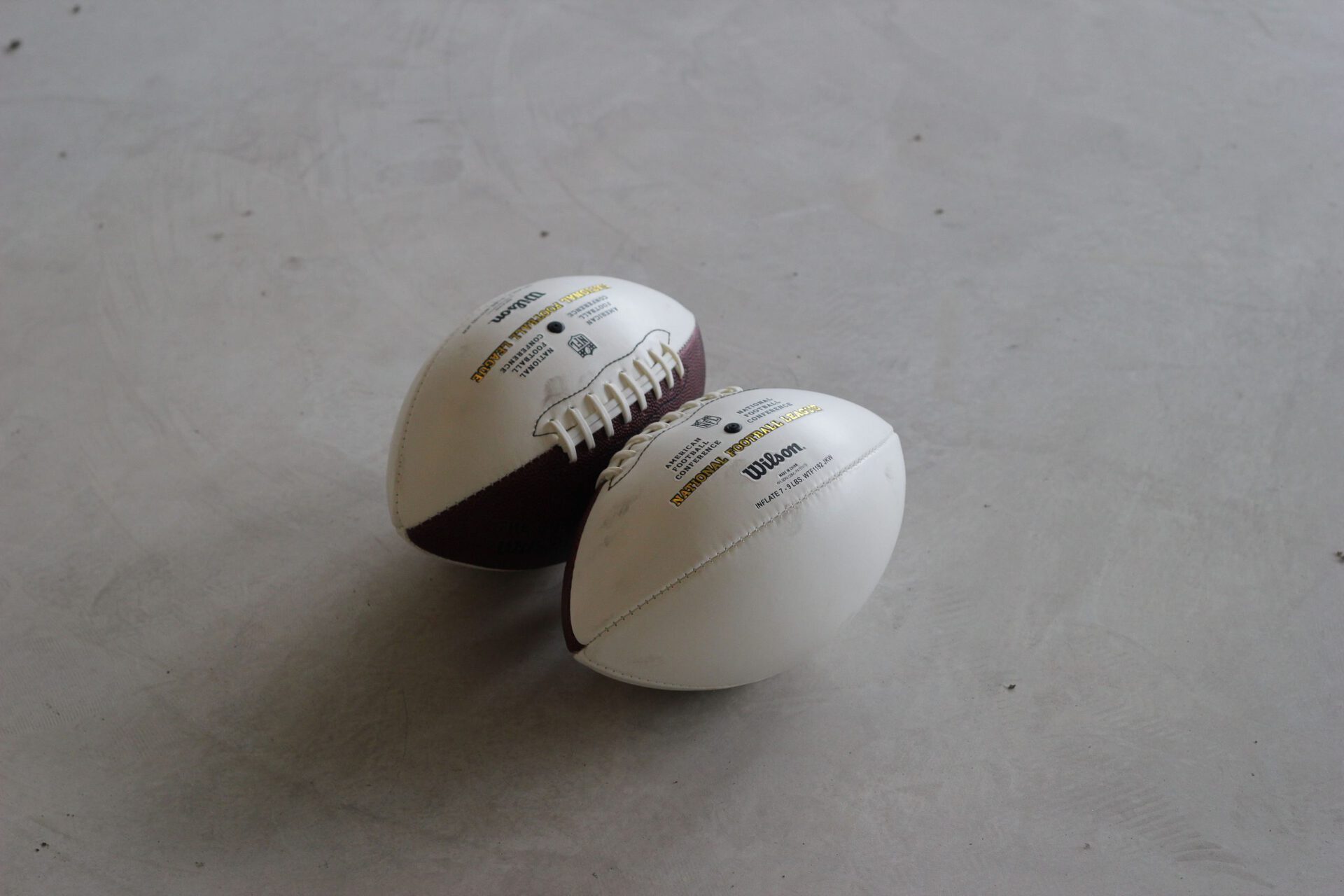 Untitled, 2021, American footballs