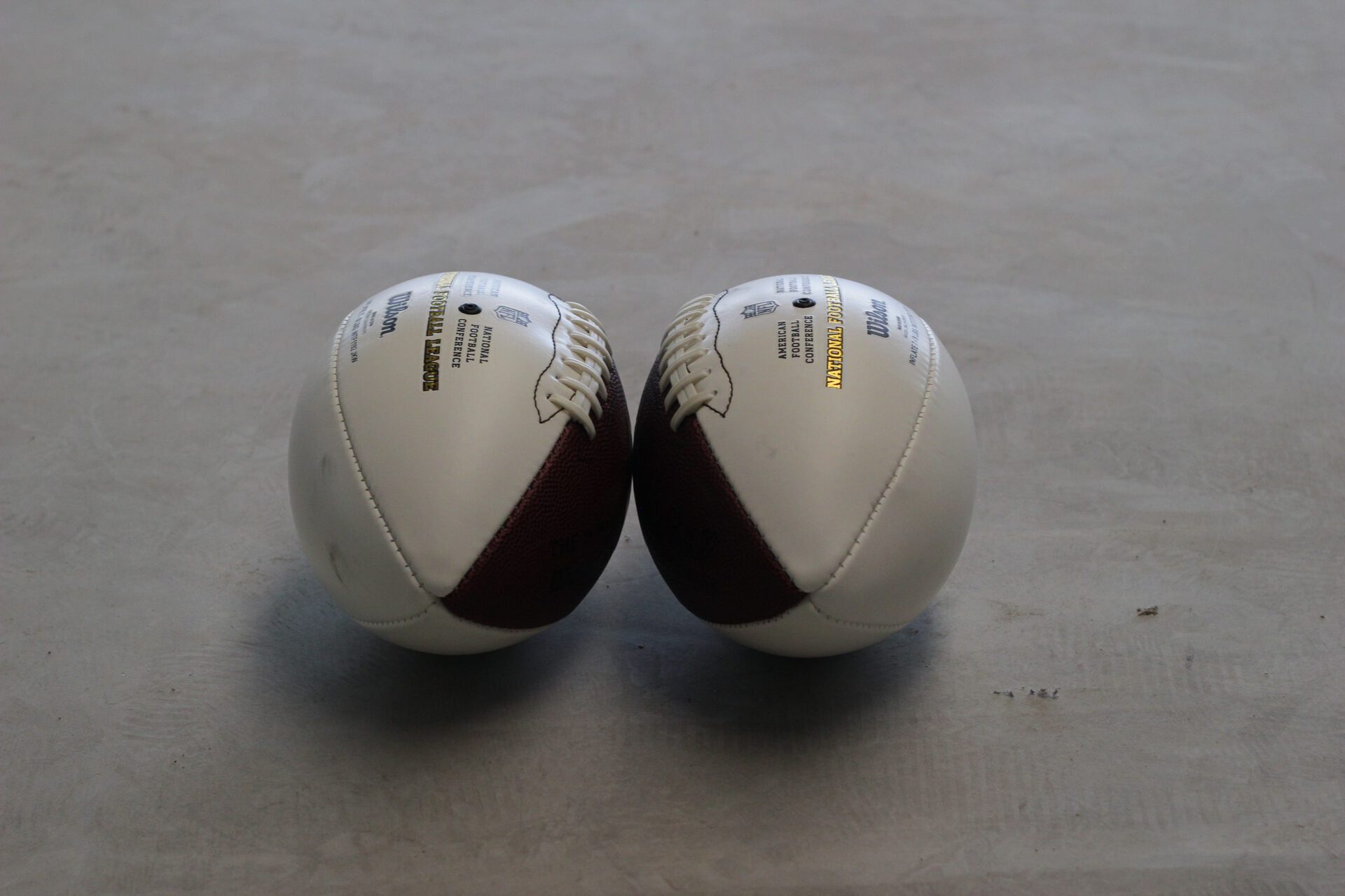Untitled, 2021, American footballs