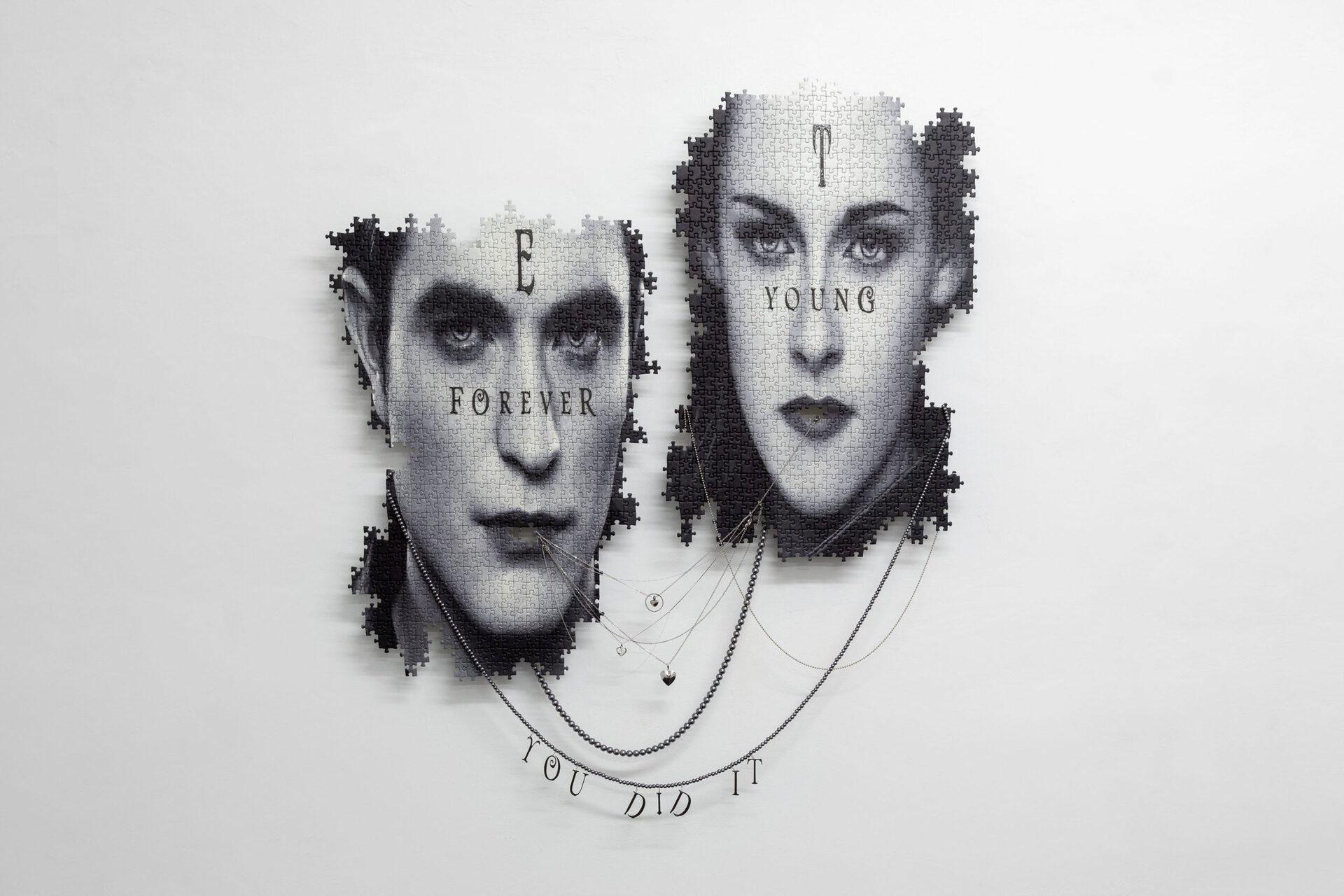 Julian-Jakob Kneer, EROS / THANATOS (YOU DID IT, FOREVER YOUNG), 2021, Digital print on puzzle, silver and steel chains, engraved silver and steel lockets, plastic coated jewelry, aluminium construction, 105cm x 90cm x 7cm