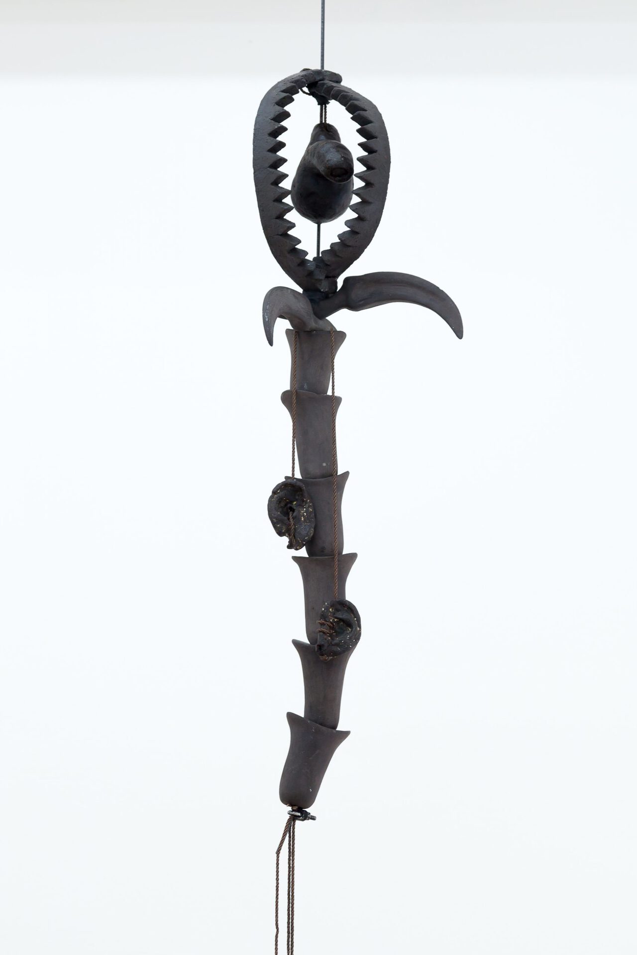 Tisiphone, 85 ×25 × 20 cm, stoneware, wax, brass chains, 2021